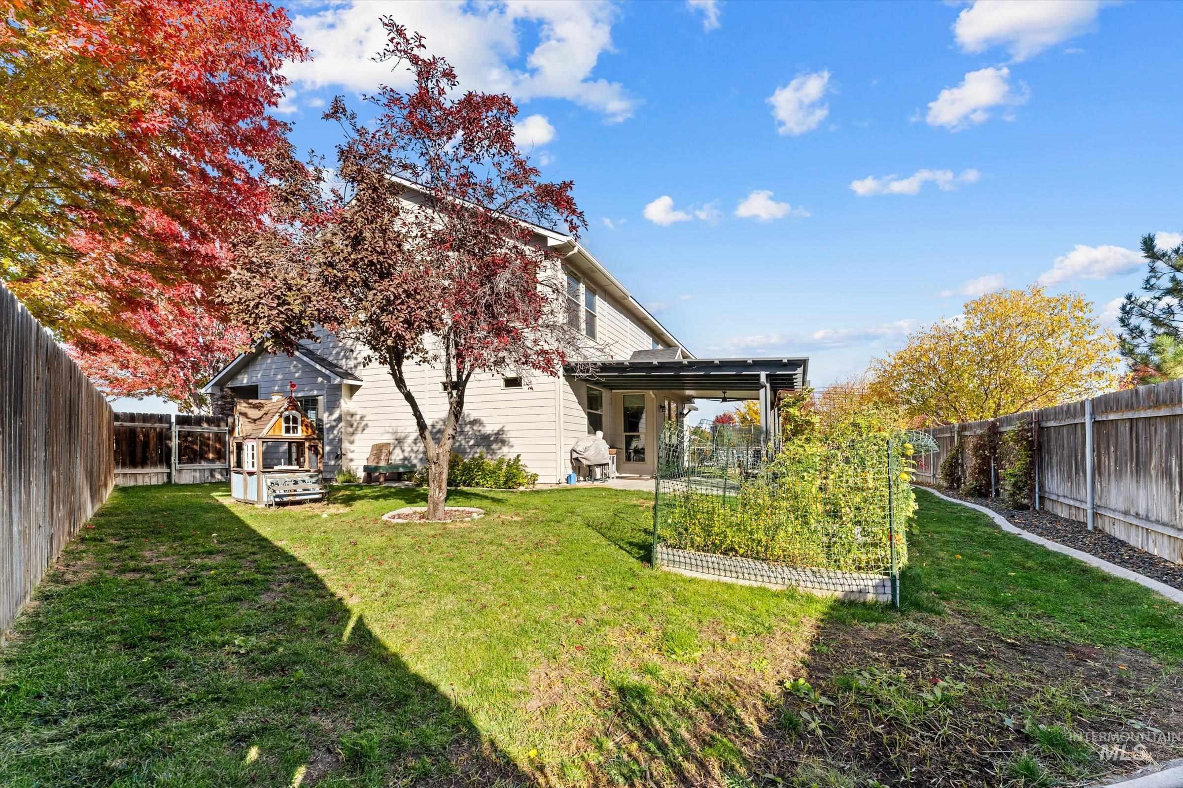 Rear view of property featuring a fenced backyard and a patio area