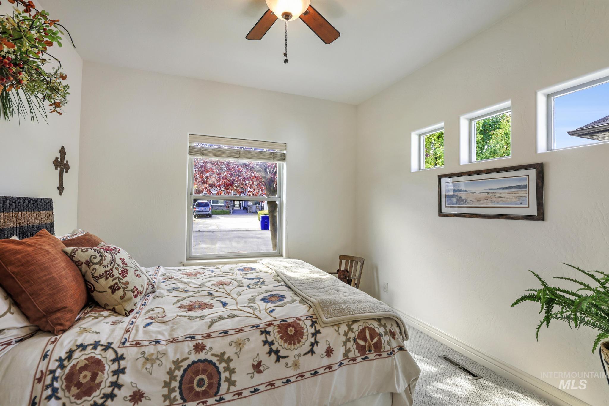 Bedroom with carpet and ceiling fan