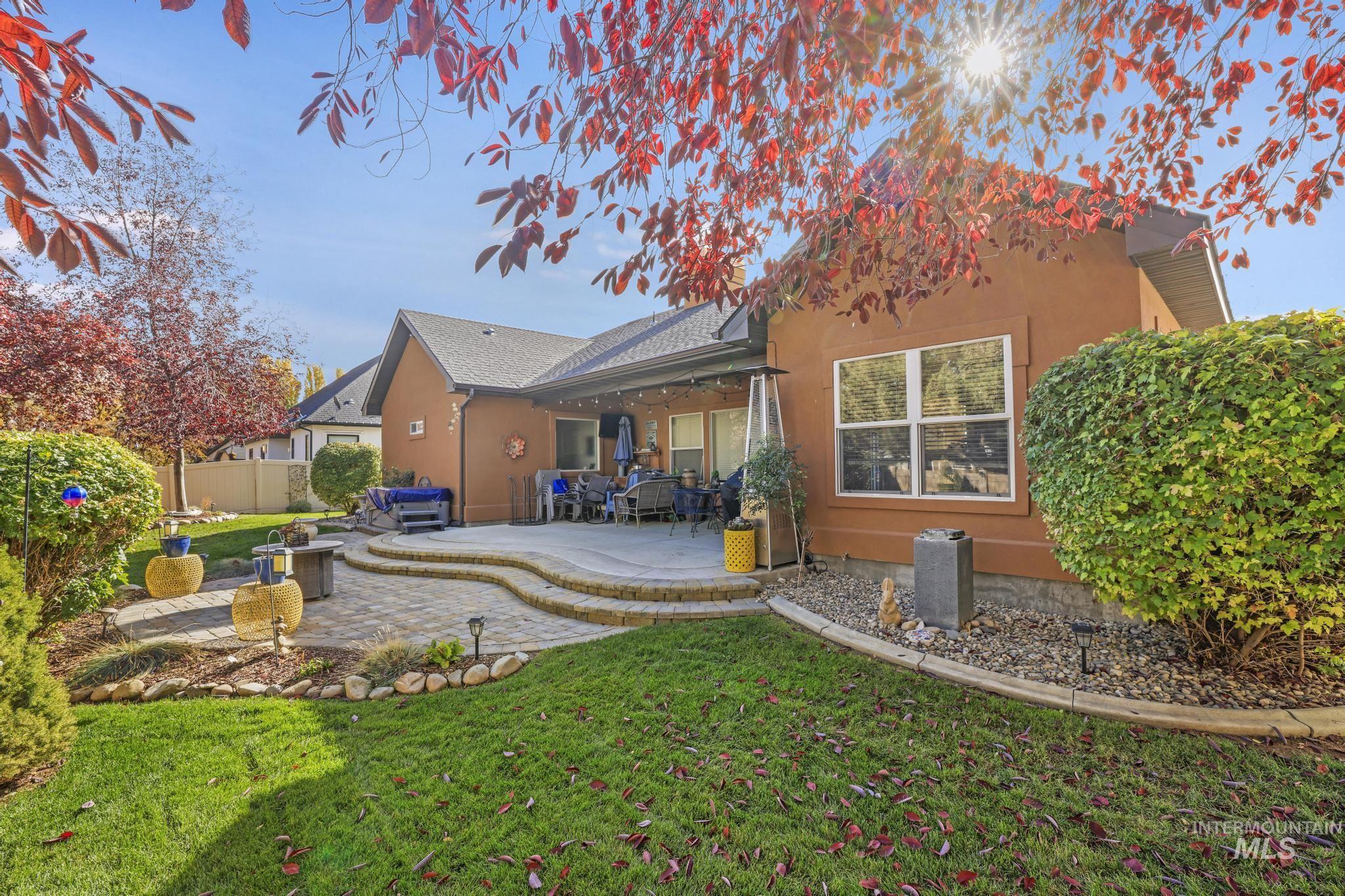 Rear view of house featuring a patio area and stucco siding