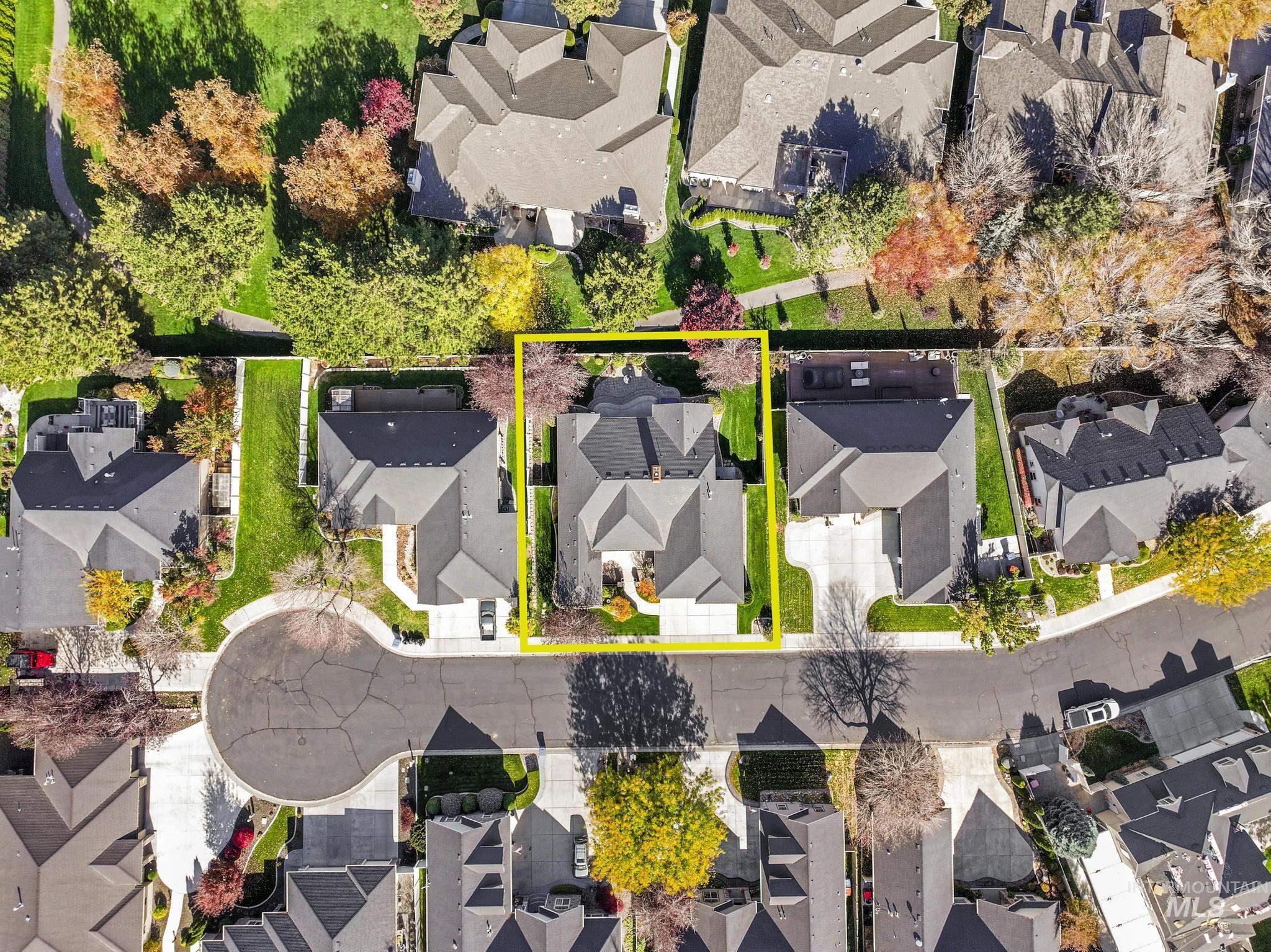 Aerial view of residential area with property parcel outlined