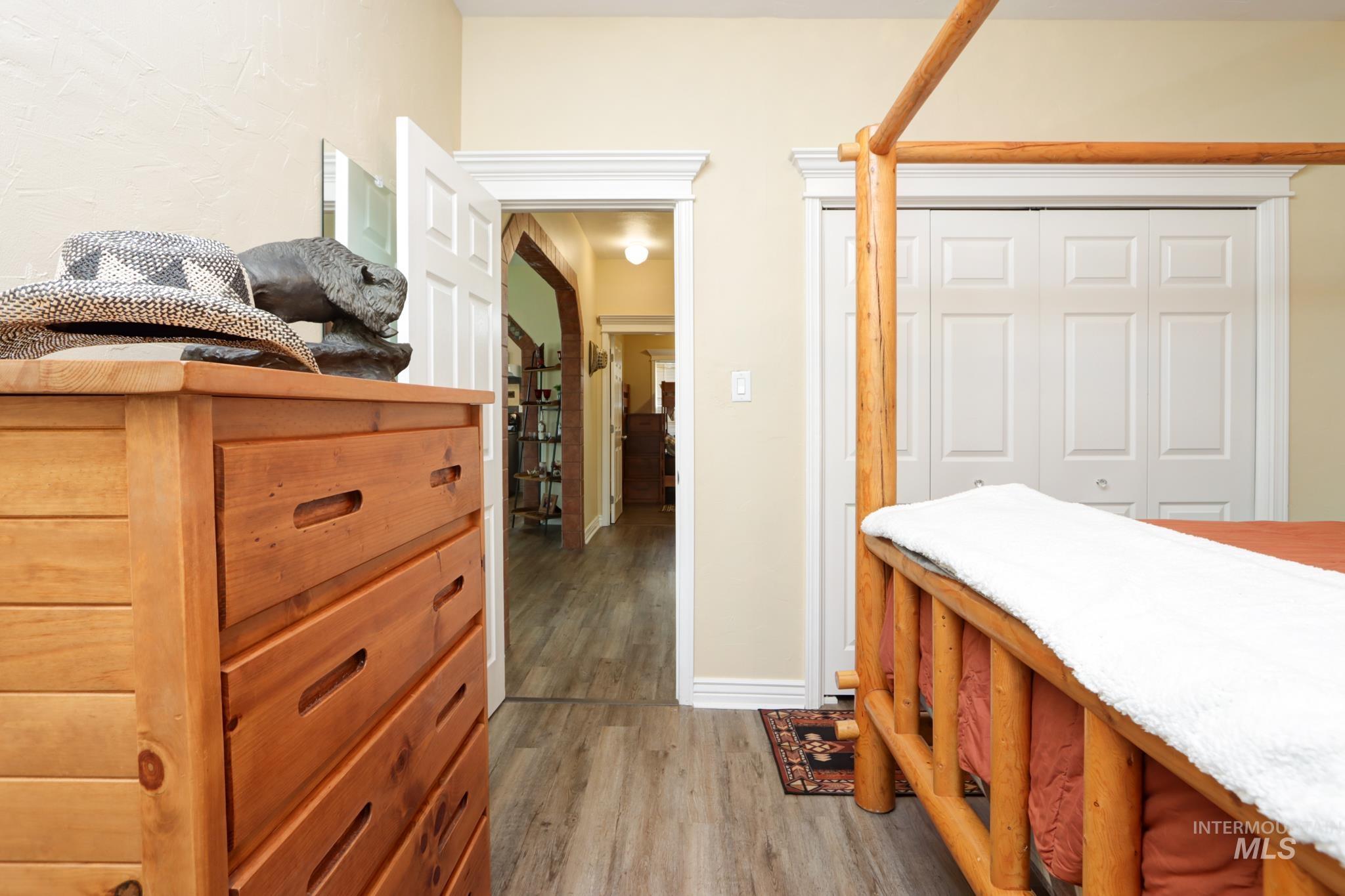 Bedroom featuring light wood-style flooring and a closet