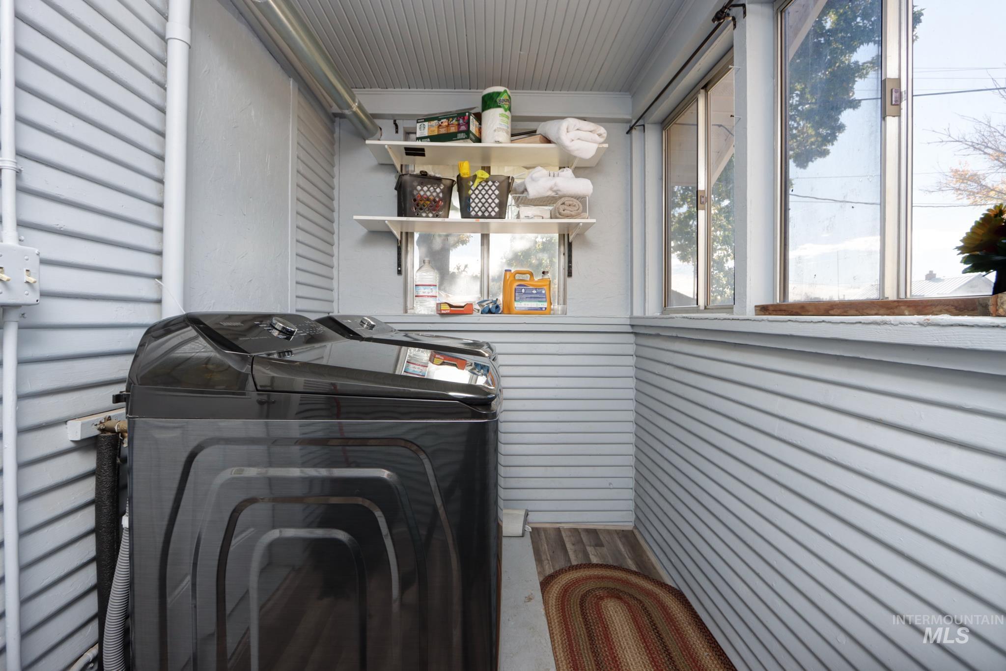 Laundry area featuring independent washer and dryer and a garage