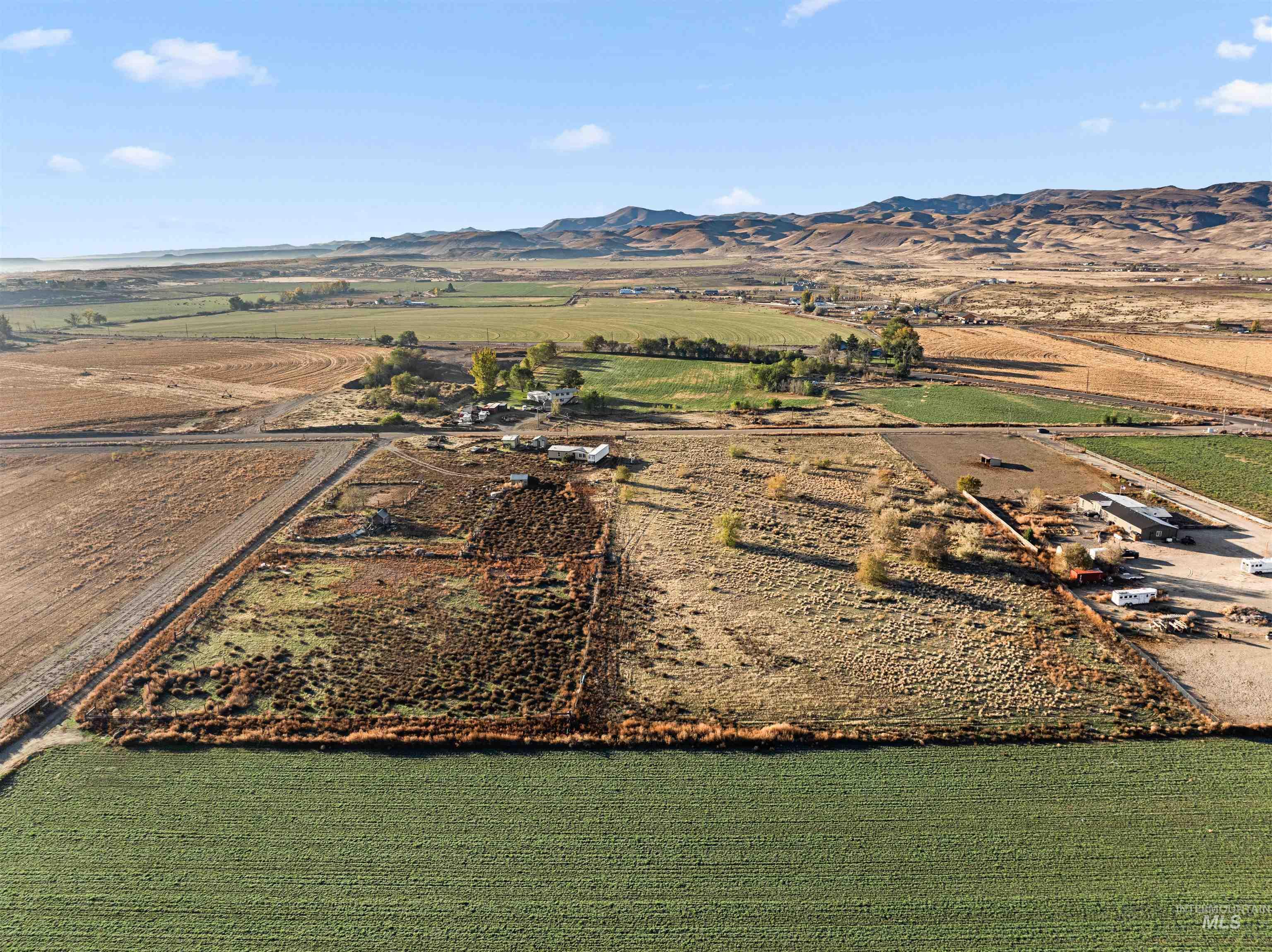 Overview of rural landscape with a mountain backdrop