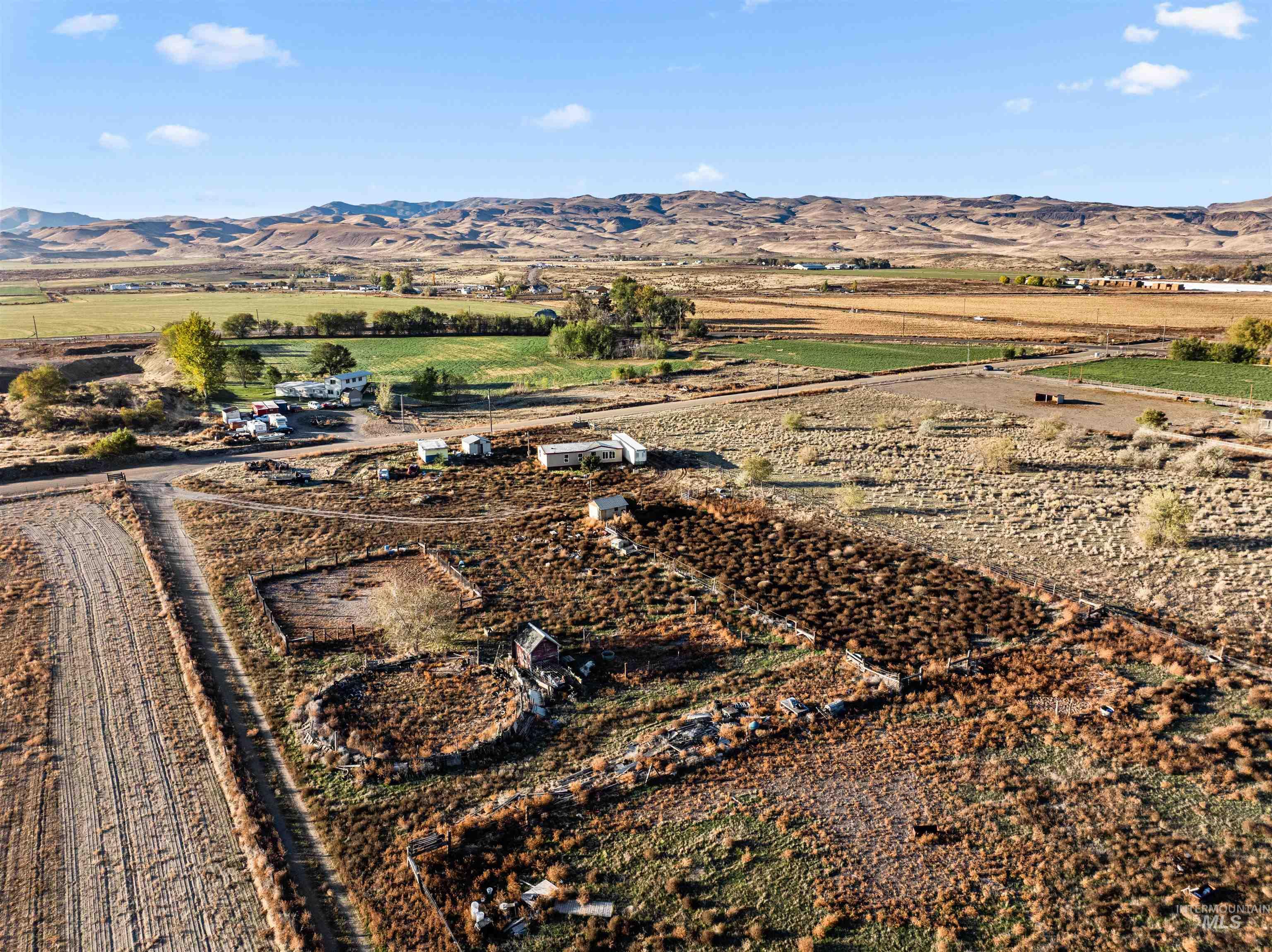 Aerial overview of property's location featuring rural landscape and mountains