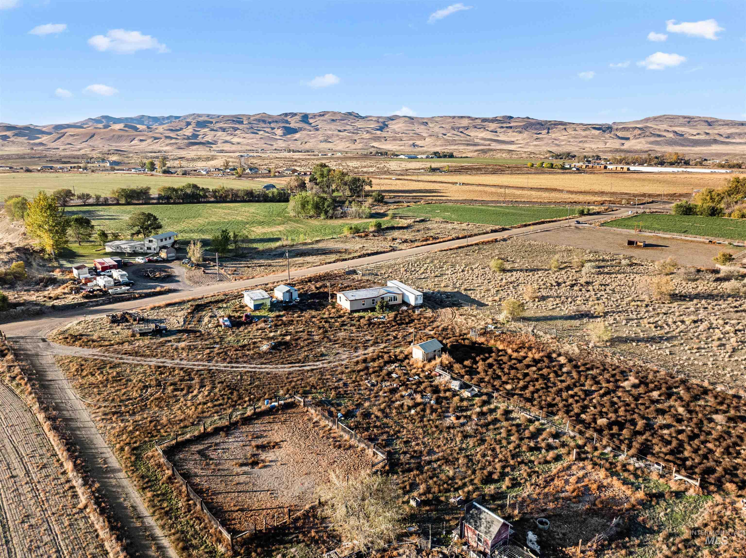 Overview of rural landscape featuring a mountainous background