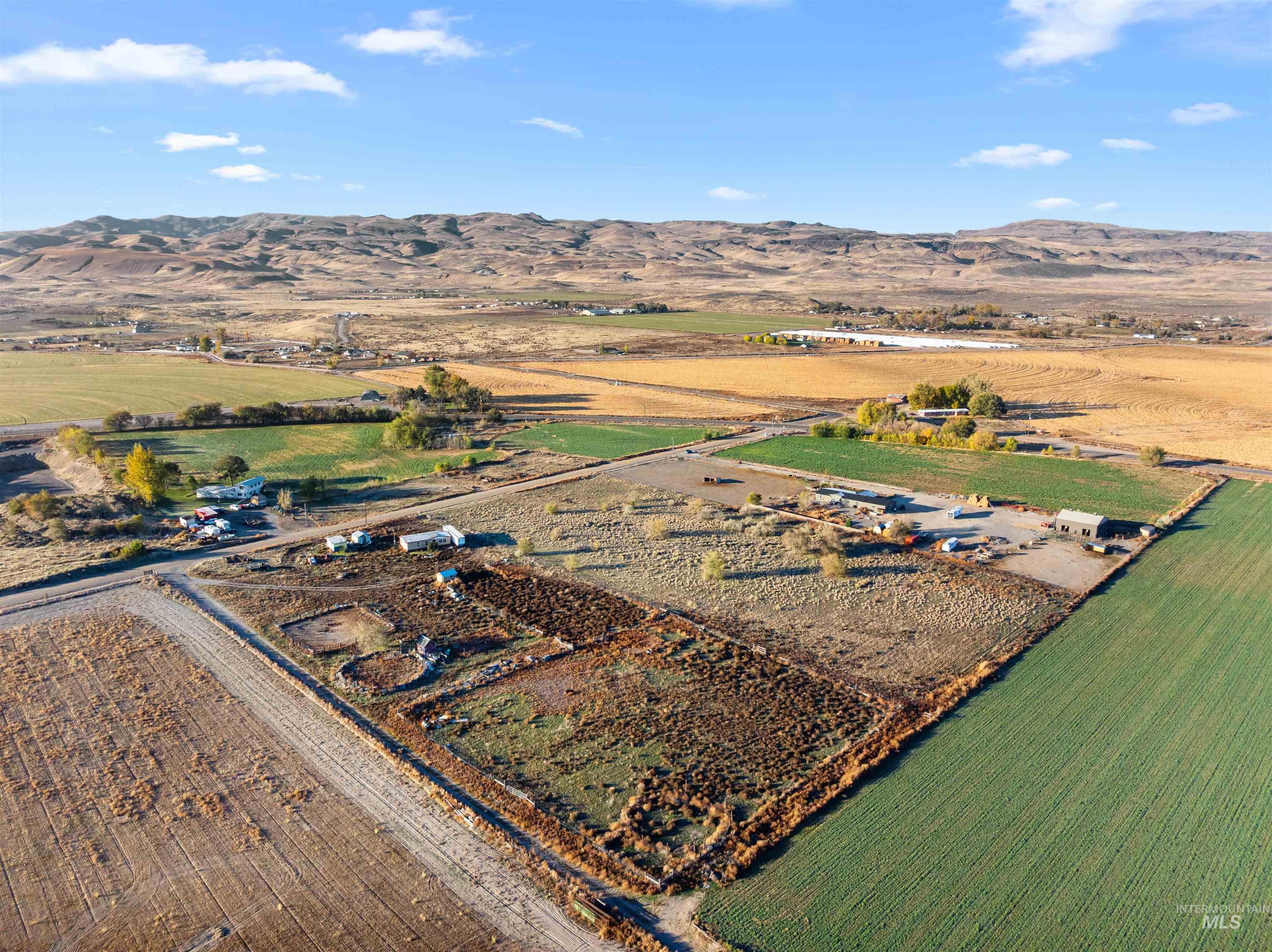 View of rural area featuring mountains and abundant farmland