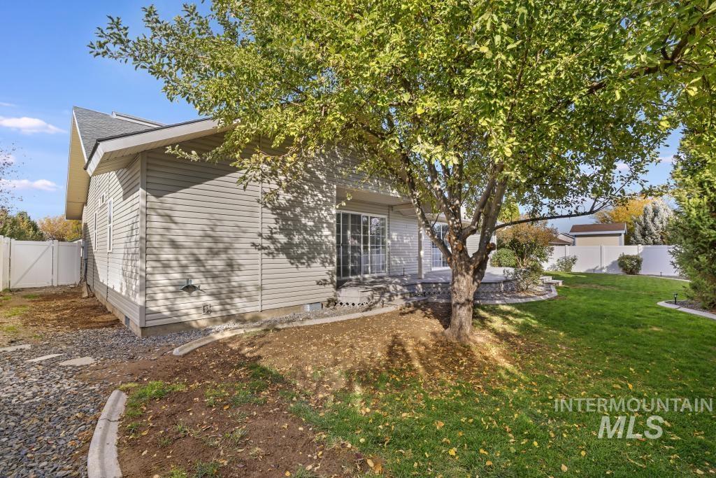 View of side of home with a patio