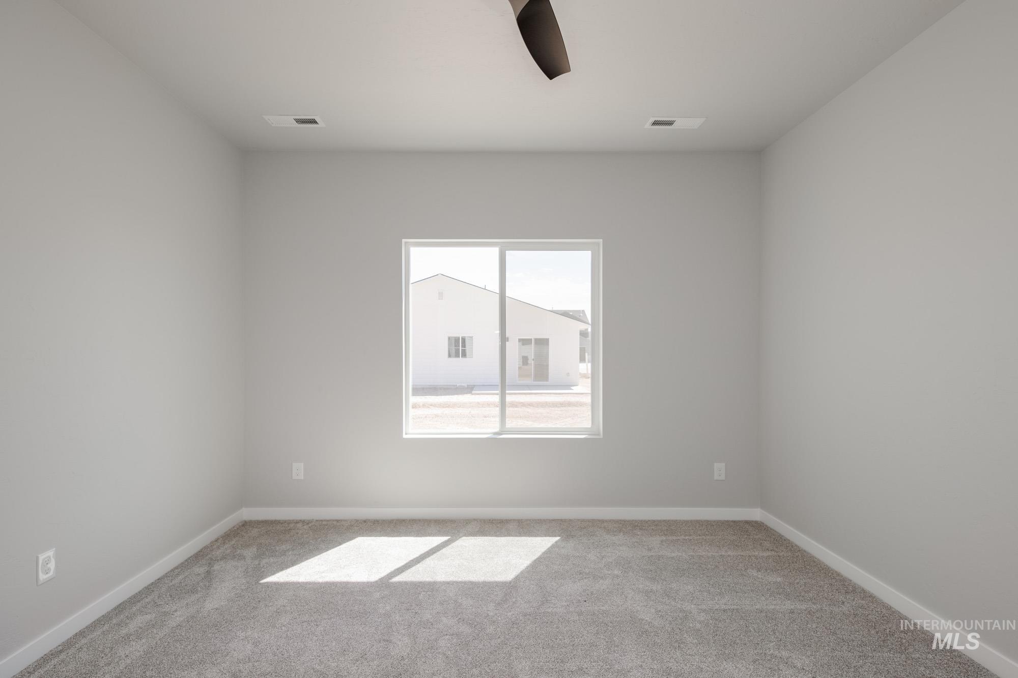 Unfurnished room featuring carpet flooring