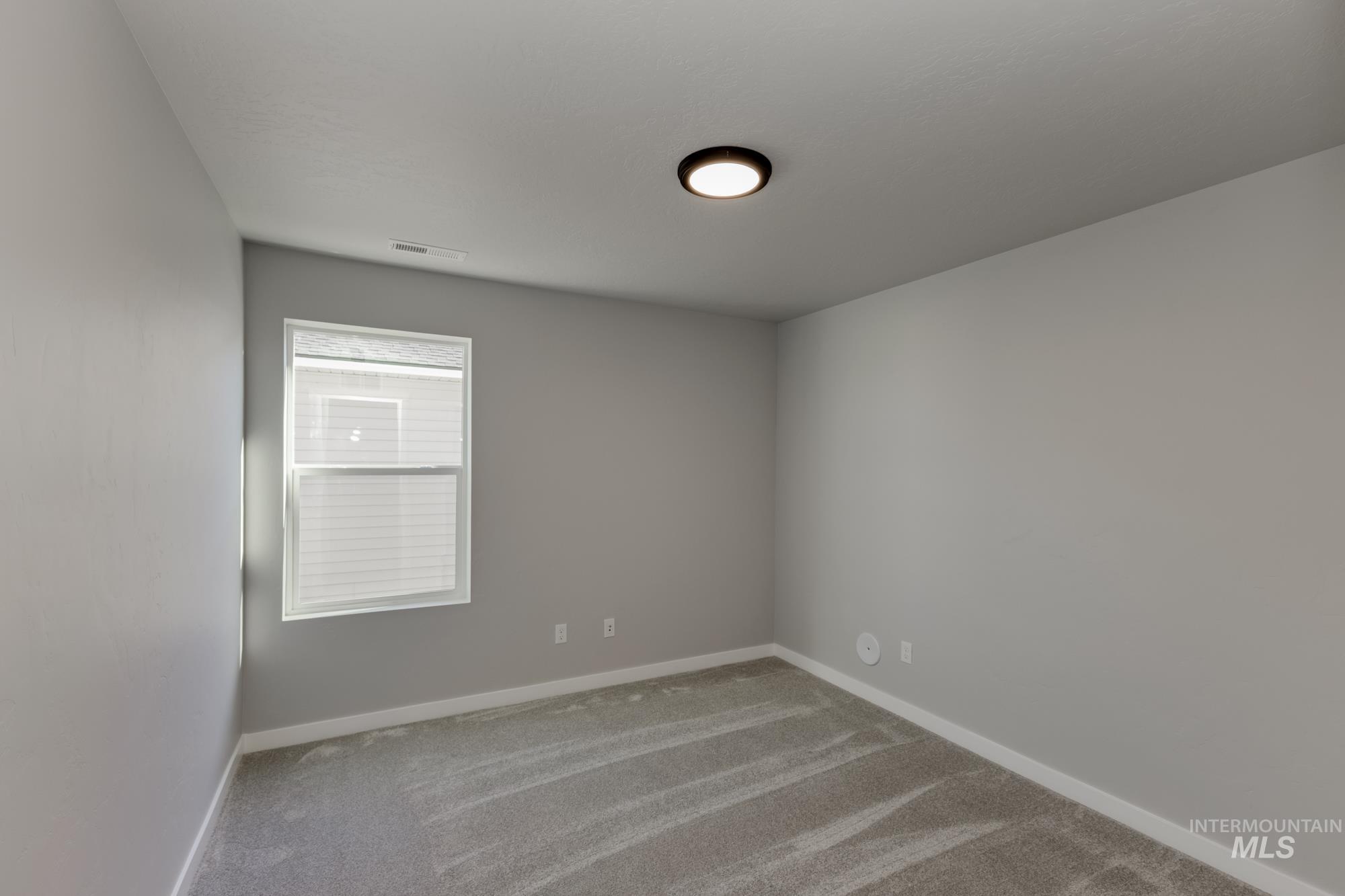 Spare room with carpet floors