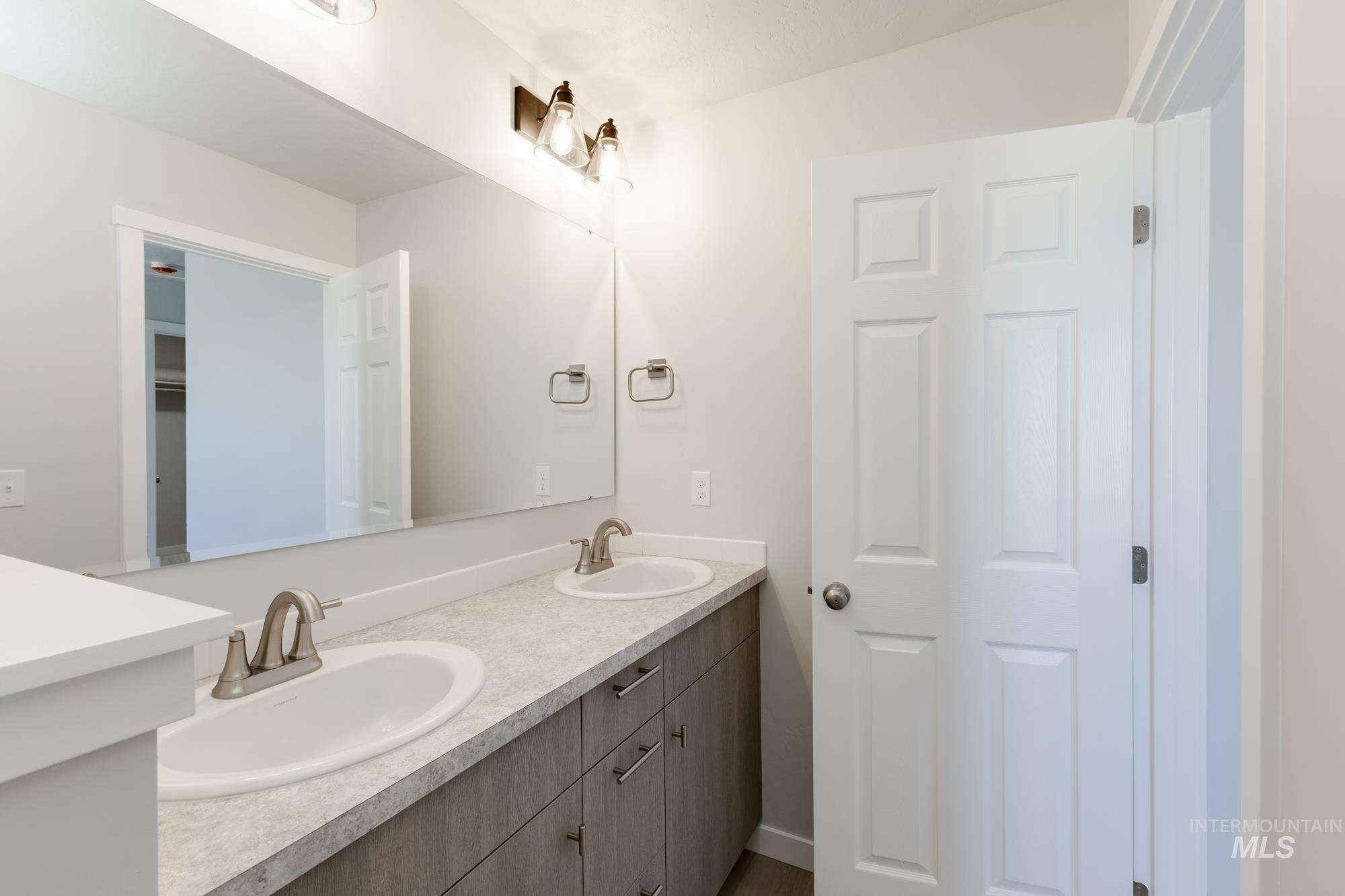 Full bathroom featuring double vanity