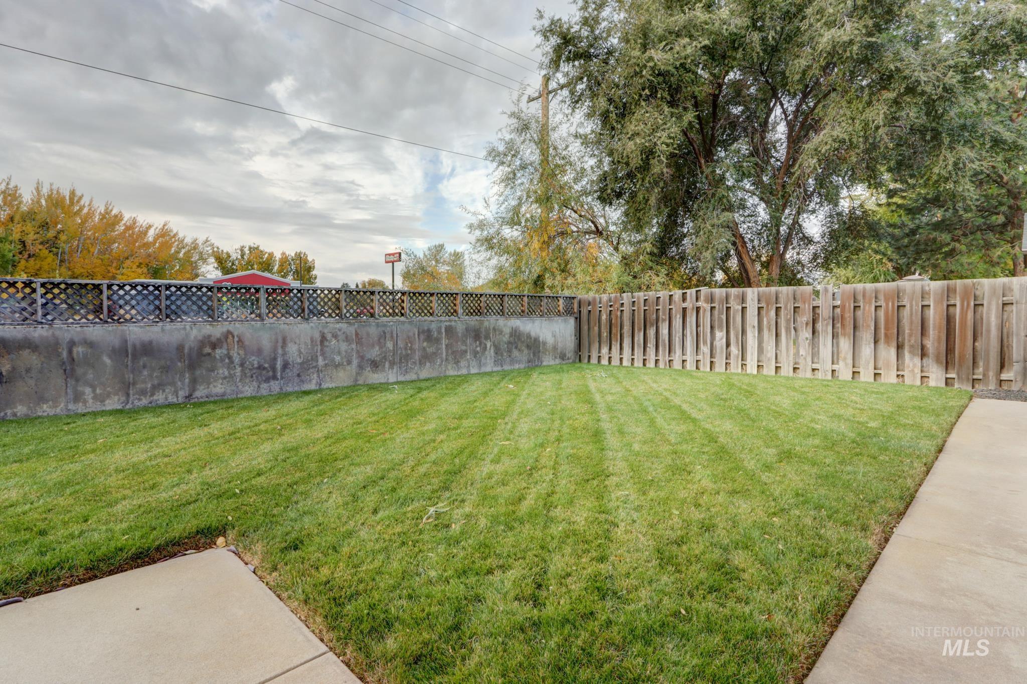 View of fenced backyard