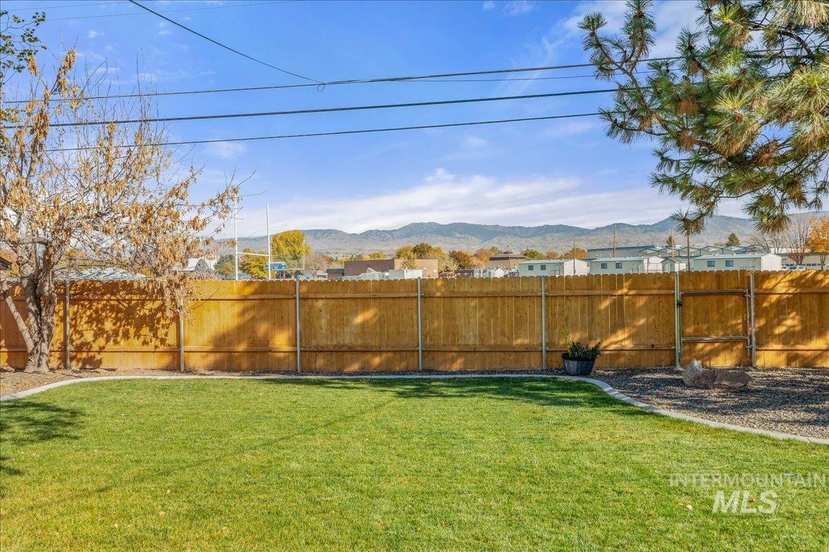 View of yard with a mountain view