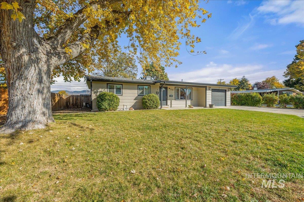Single story home featuring driveway and an attached garage