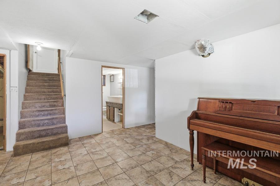 Sitting room featuring stairway