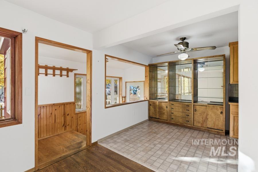 Foyer featuring light wood finished floors and ceiling fan