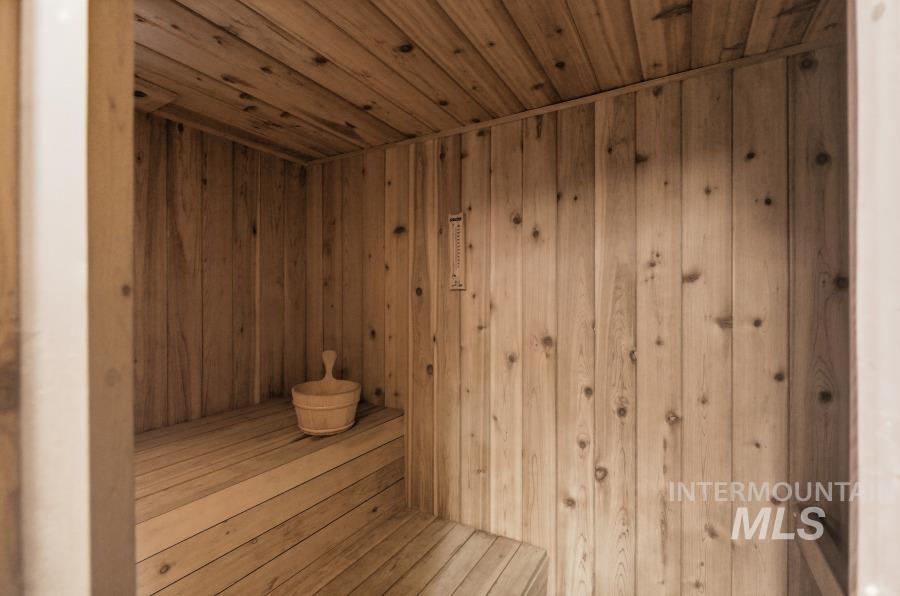 Relaxing sauna with wooden ceiling and wood walls
