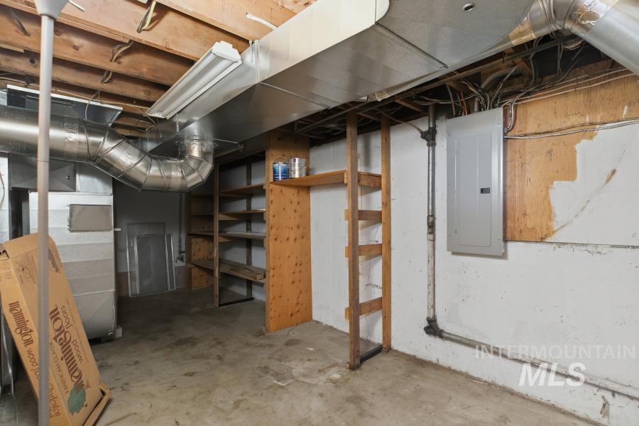 Unfinished basement featuring electric panel