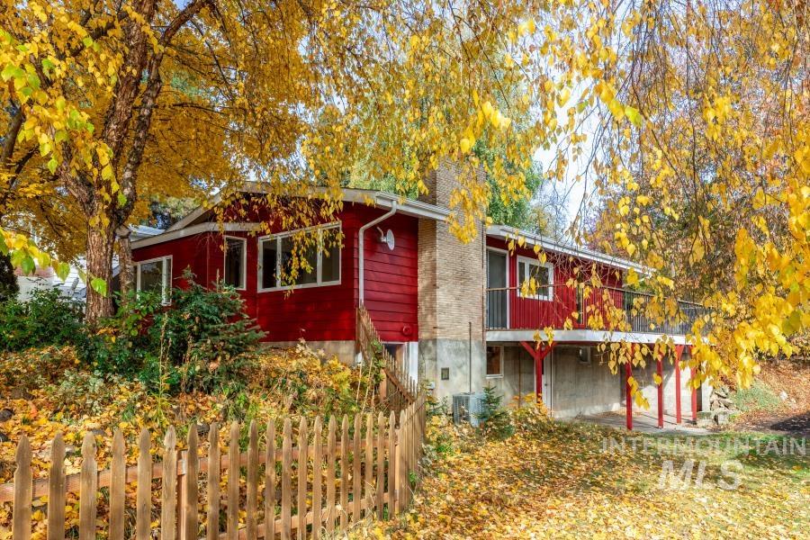 View of property exterior featuring a balcony