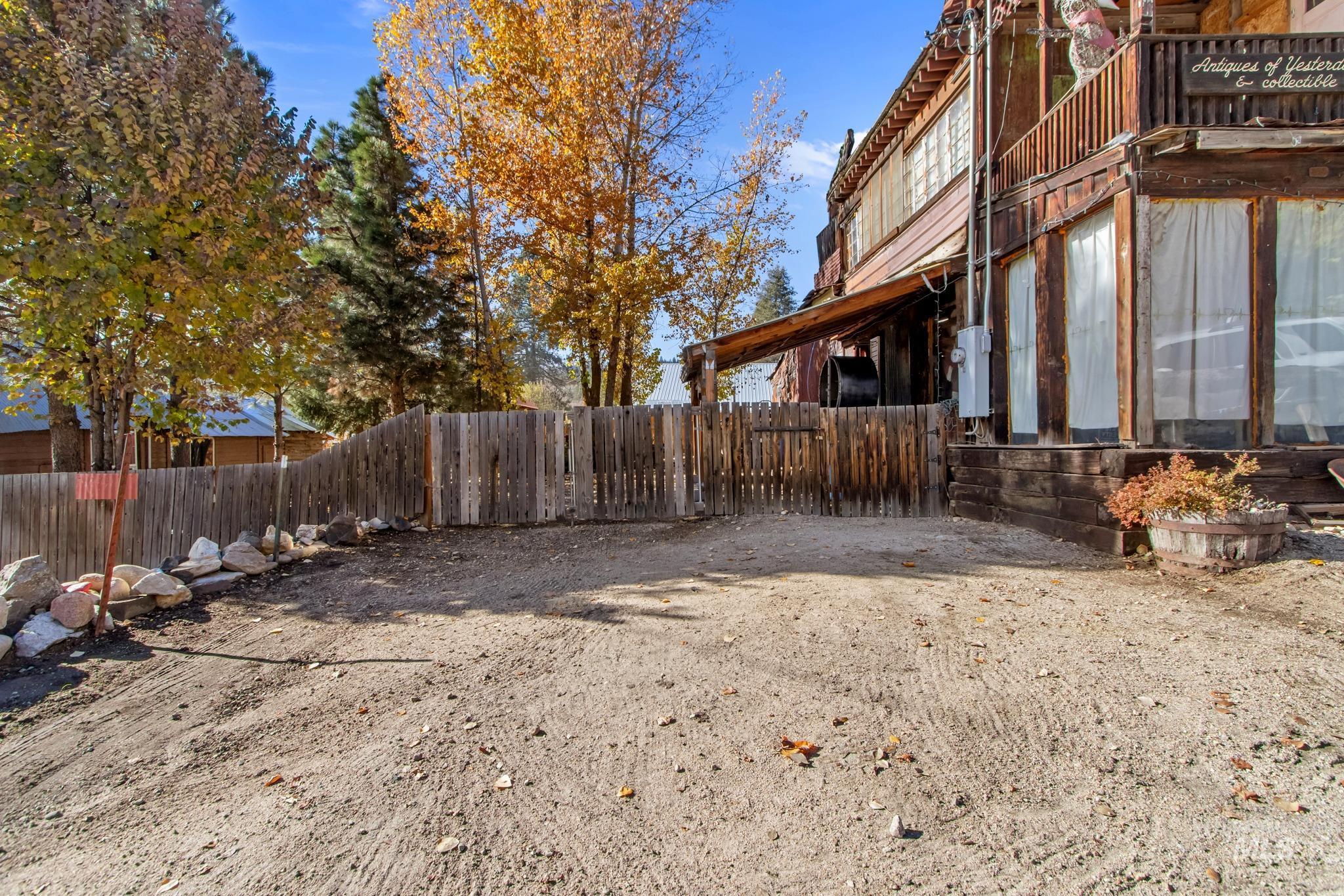 View of yard featuring a balcony and a sunroom