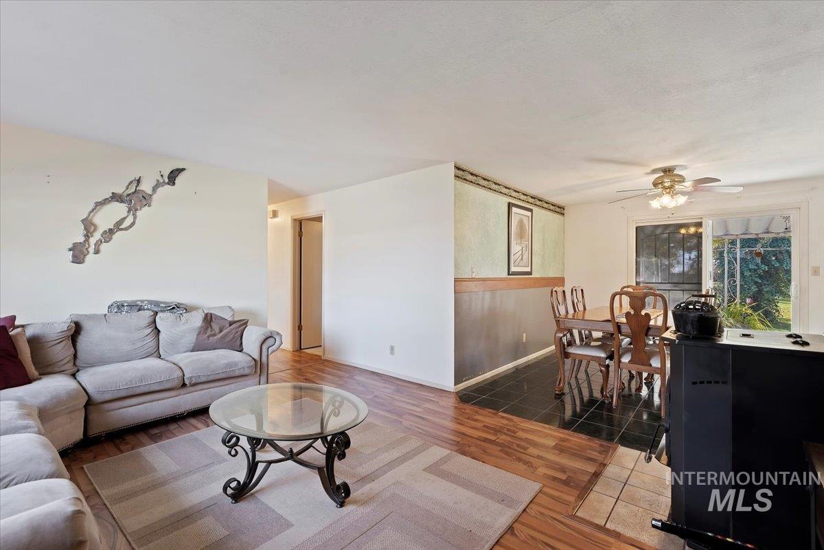 Living room featuring wood finished floors and ceiling fan