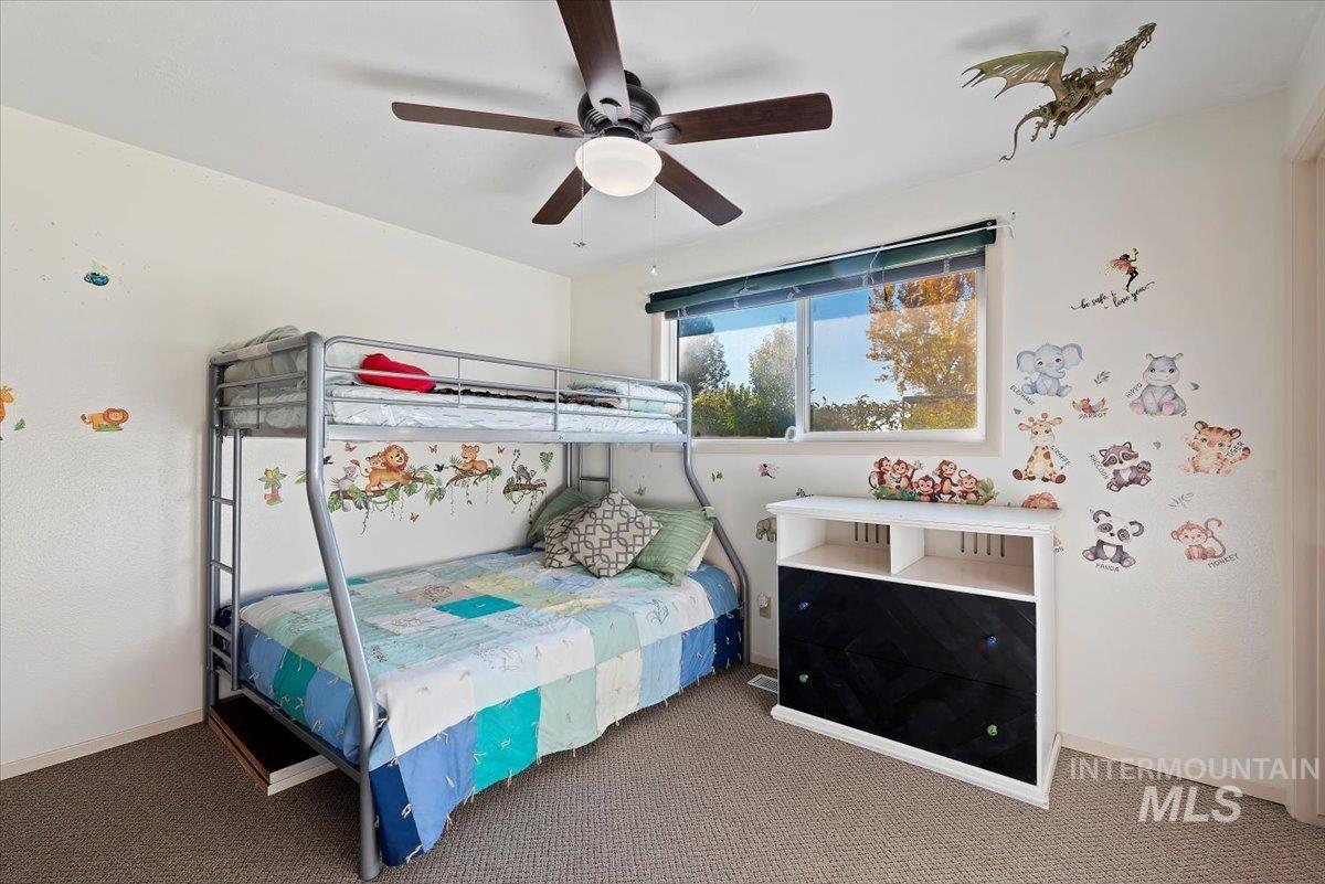 Bedroom featuring carpet flooring and a ceiling fan