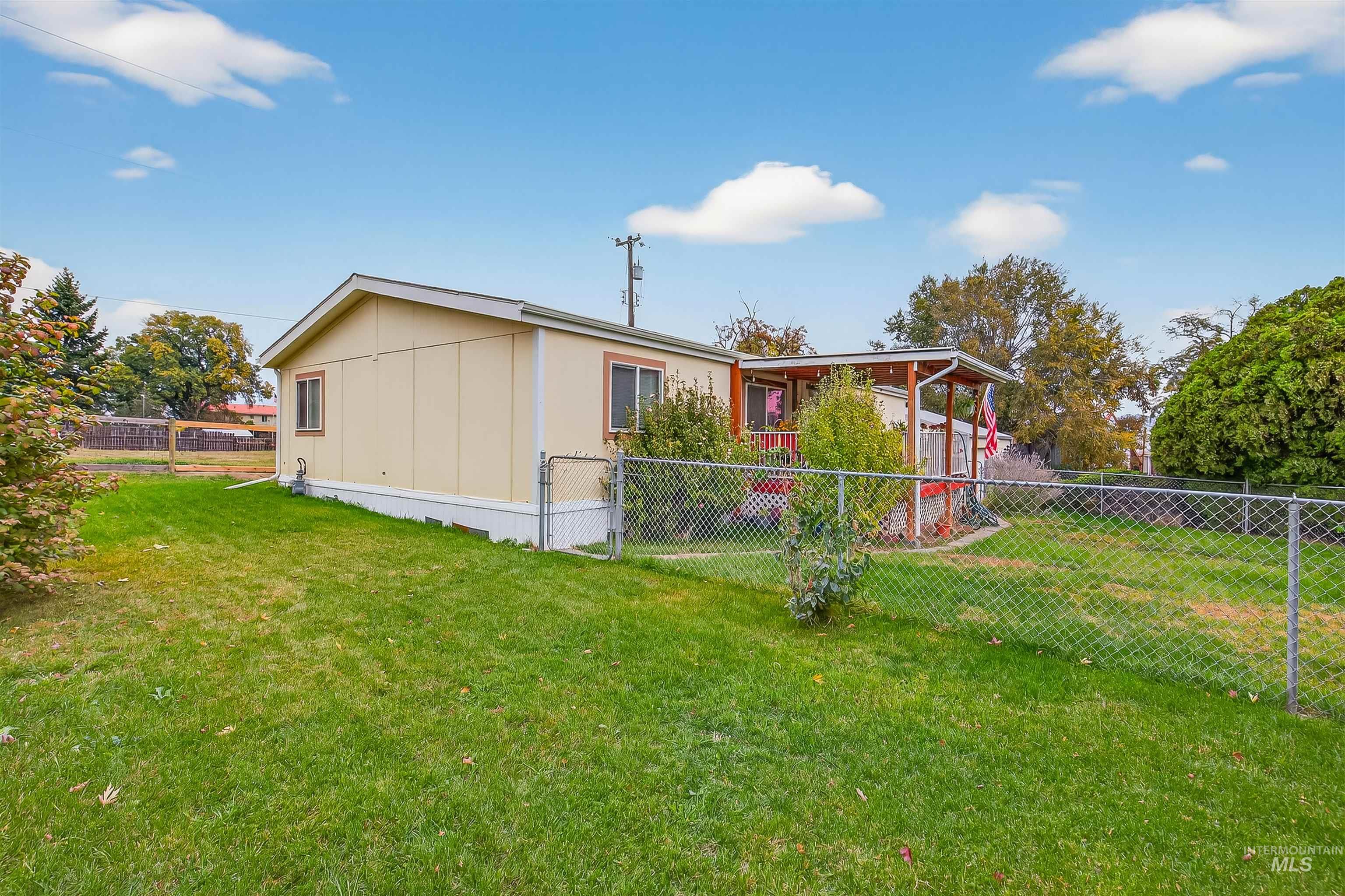 Back of property with a fenced backyard