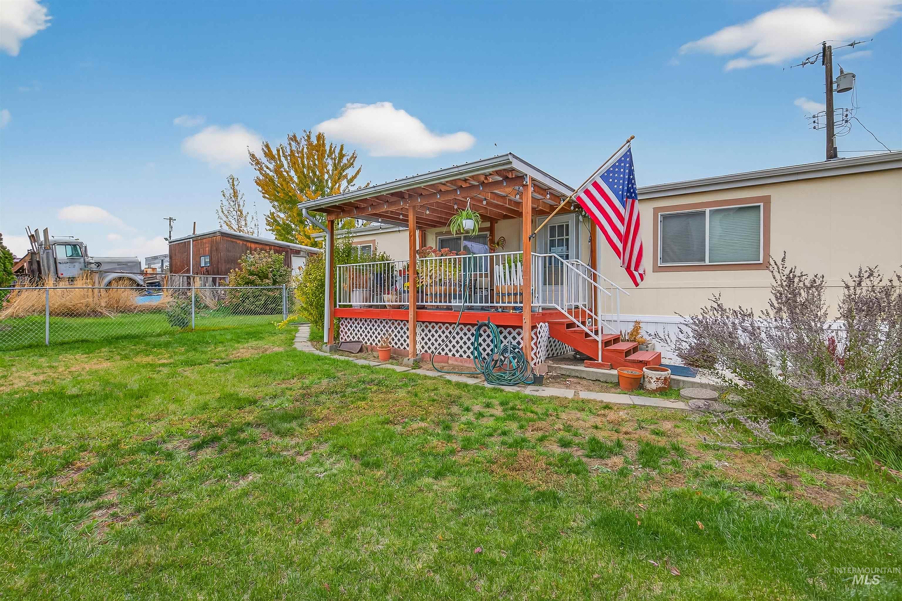 View of yard featuring a wooden deck