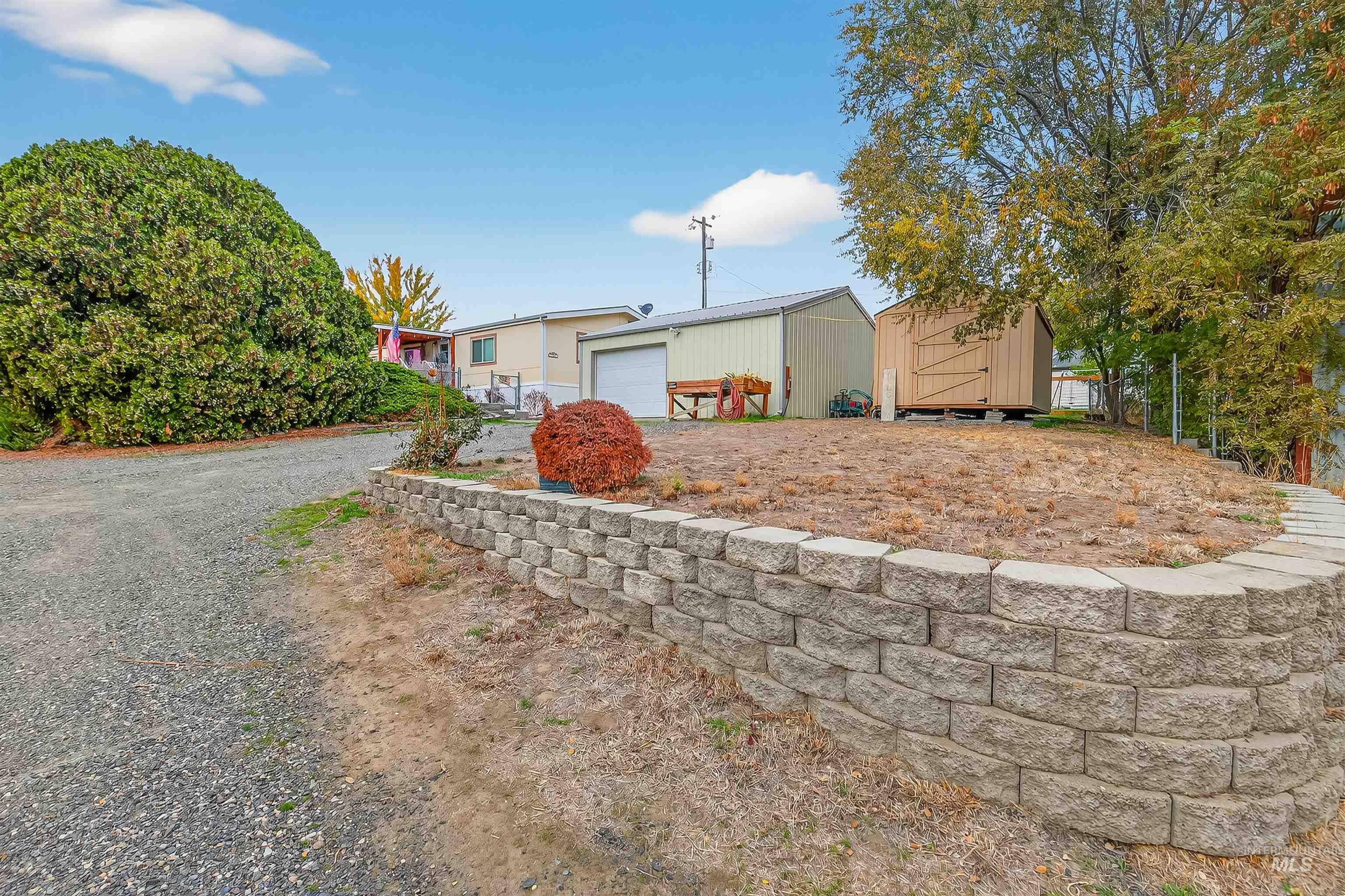 Single story home featuring an outdoor structure and a garage