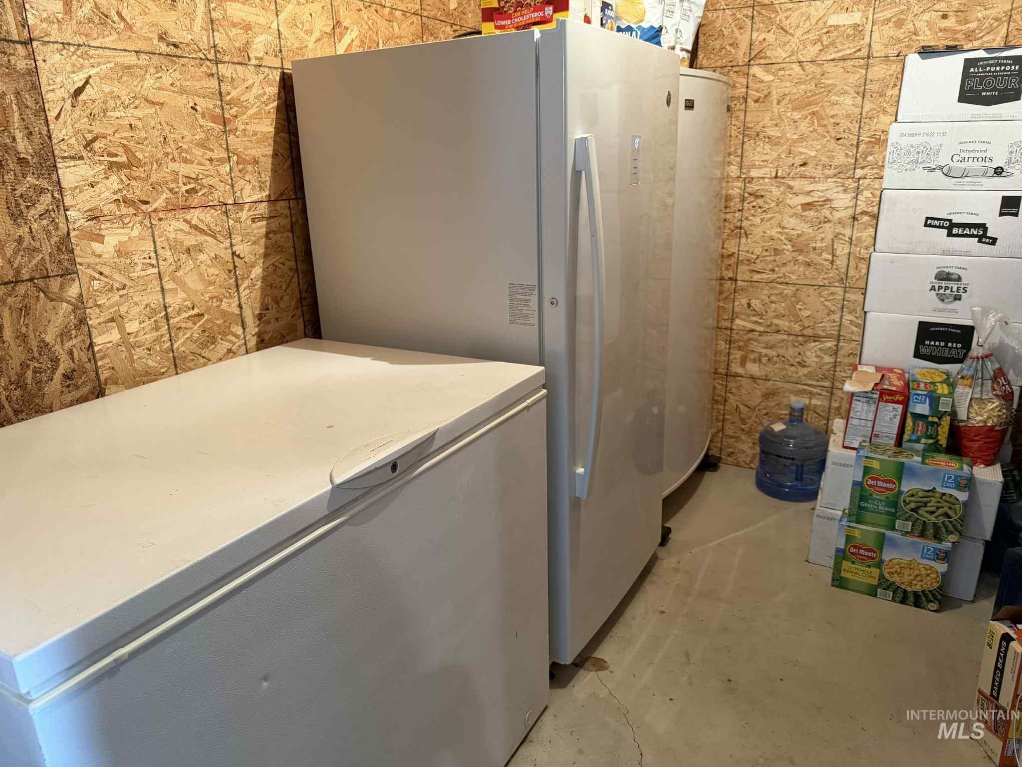 Laundry room with tile walls