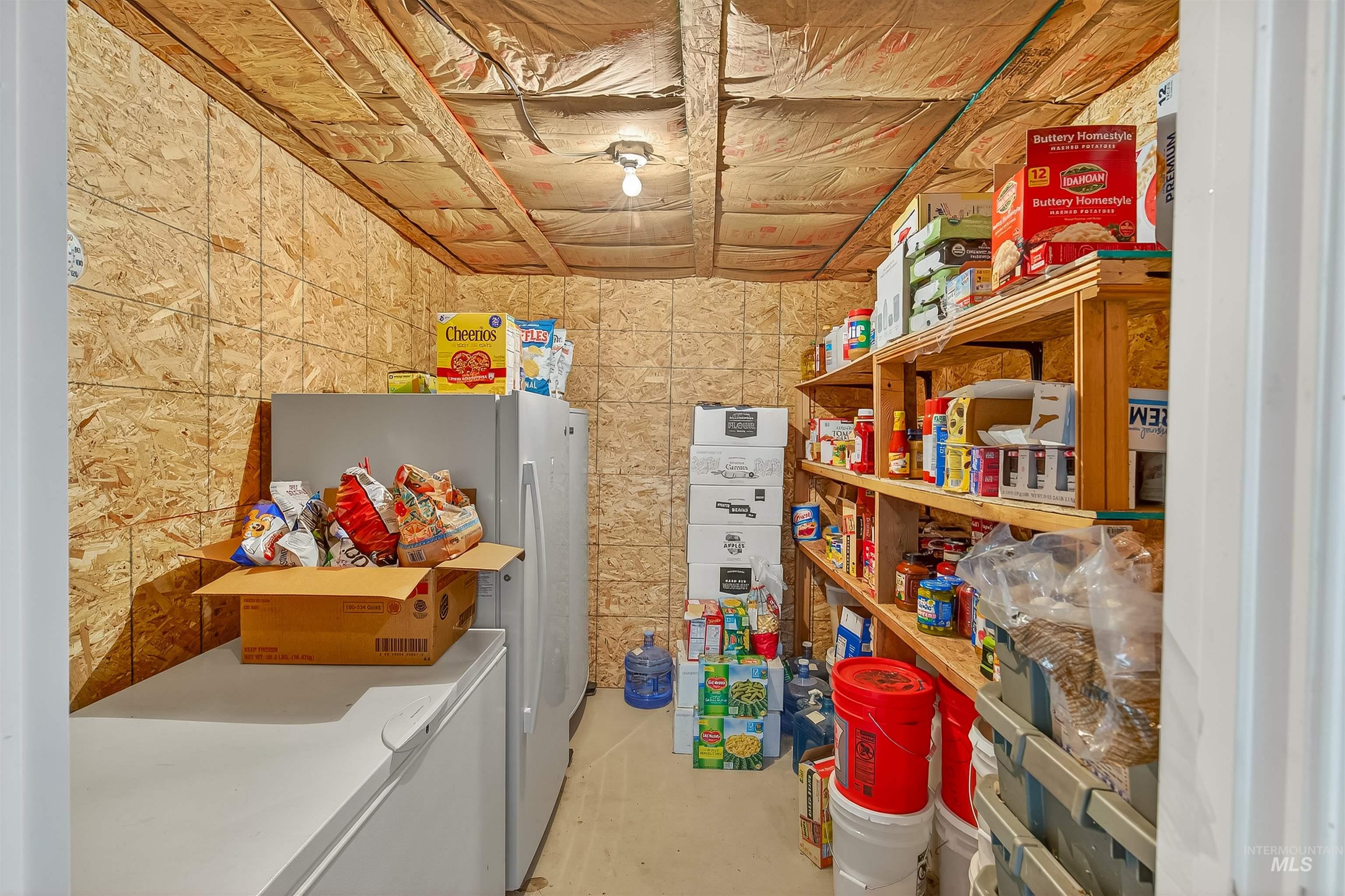 Washroom featuring washing machine and clothes dryer and tile walls
