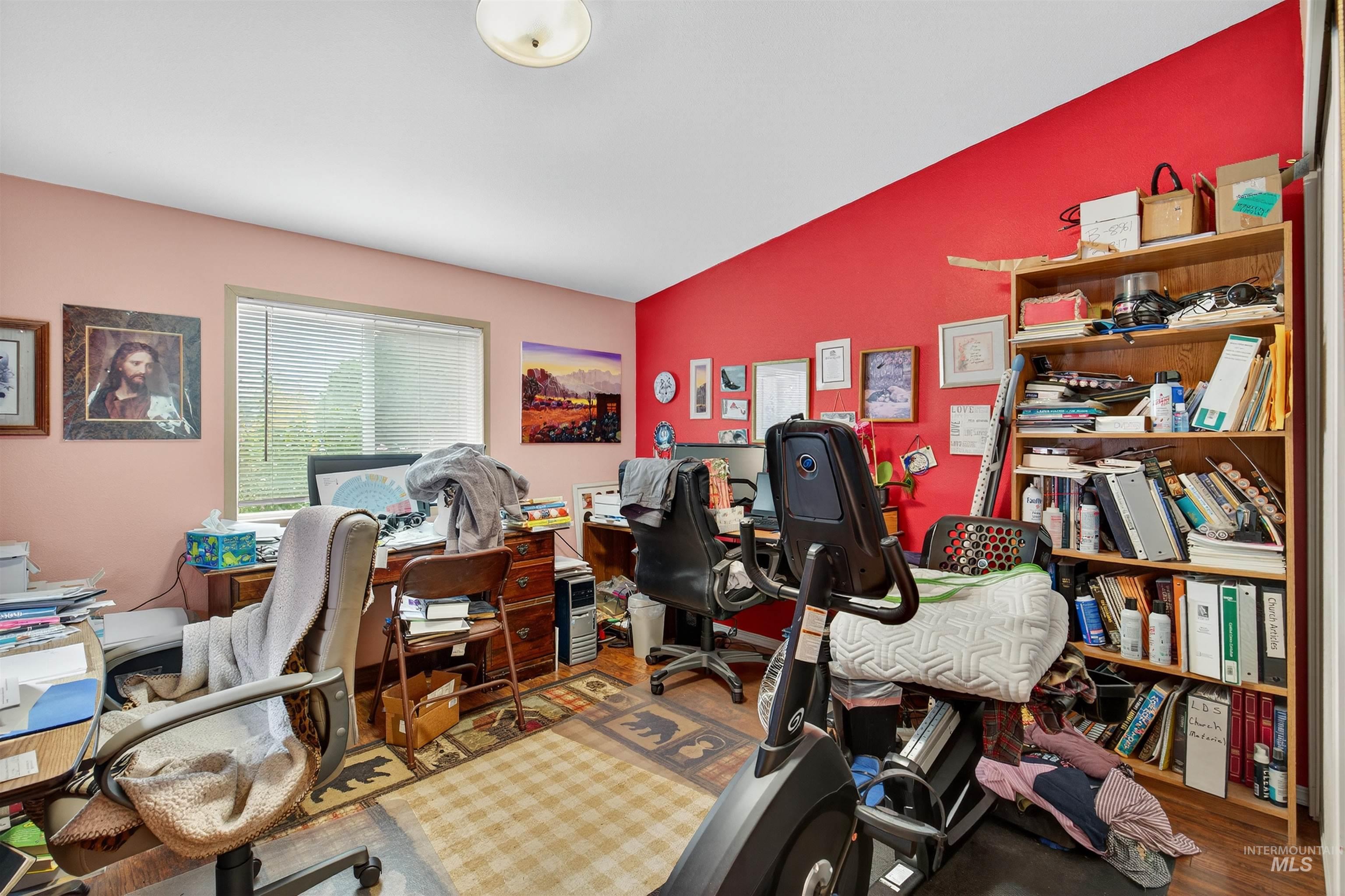 Home office with wood finished floors