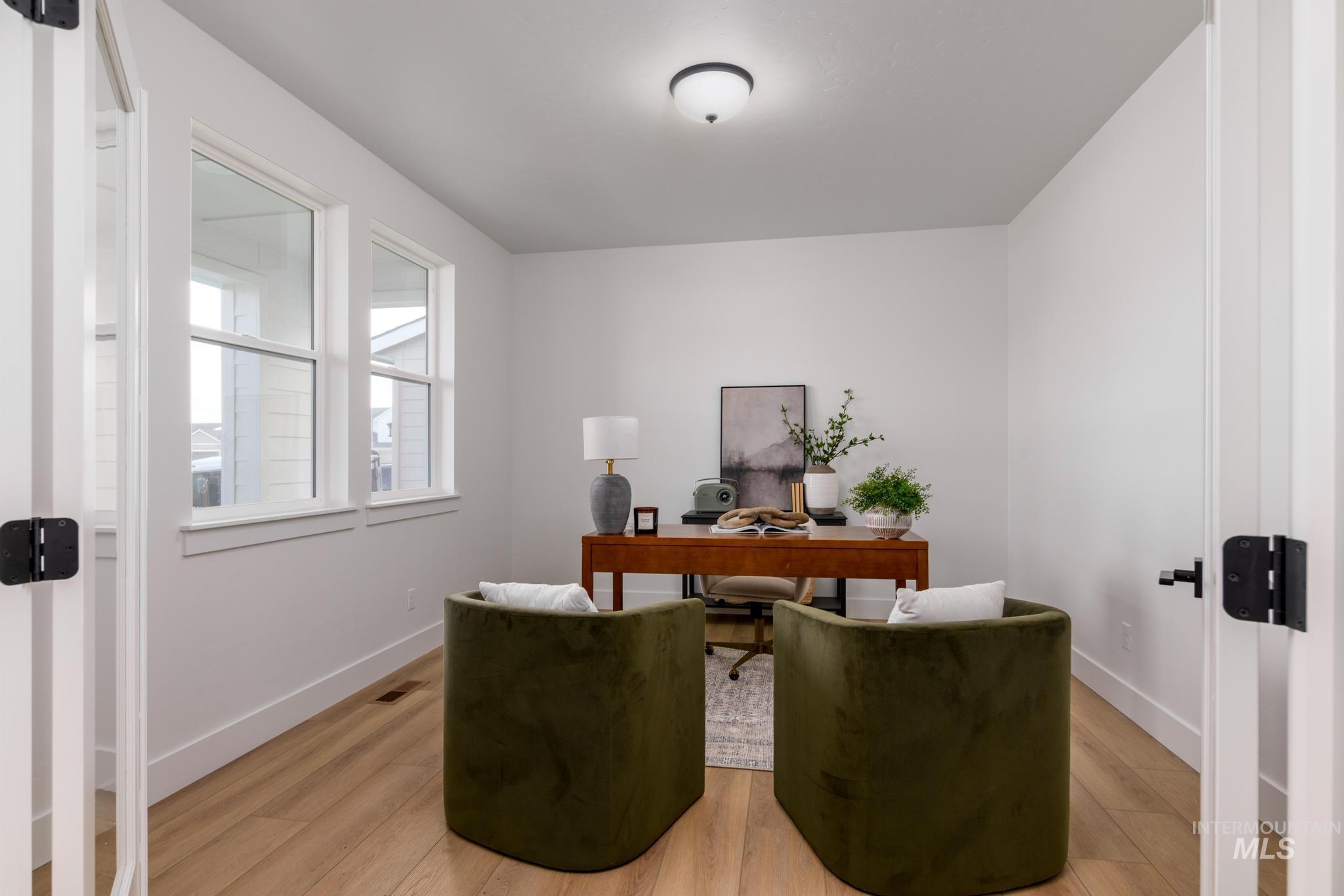 Office area featuring light wood finished floors and baseboards