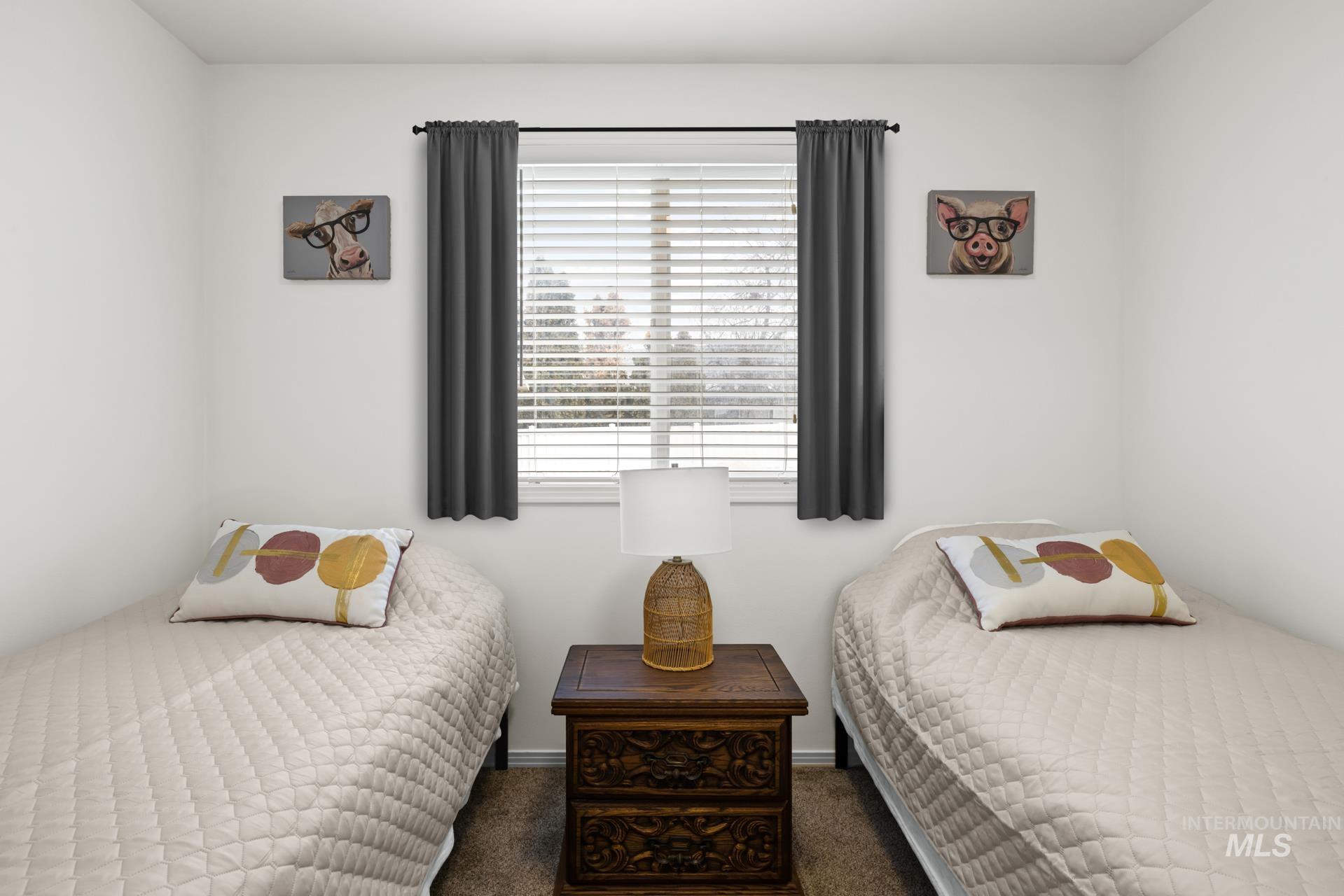 Bedroom featuring dark colored carpet