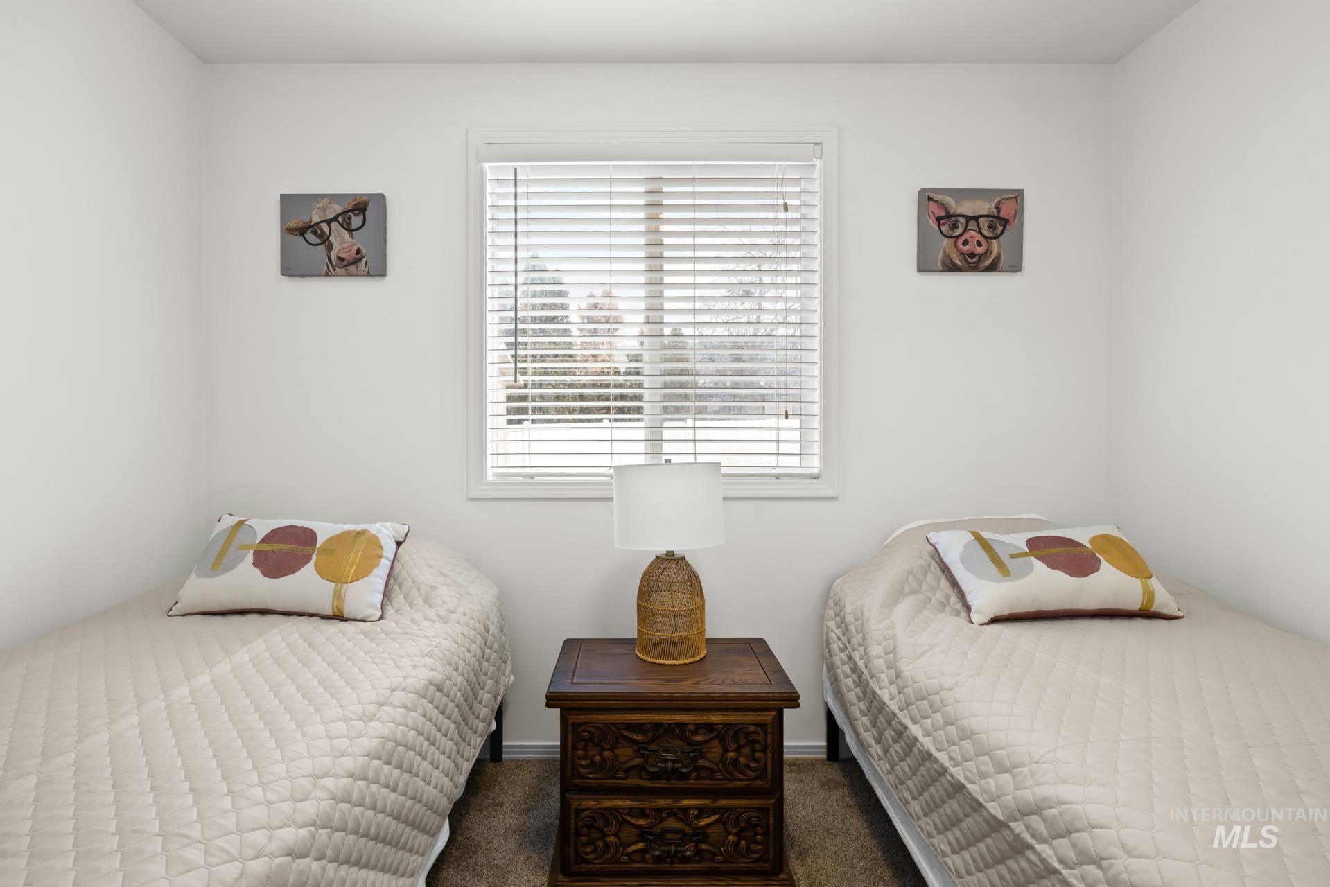 Bedroom featuring dark carpet