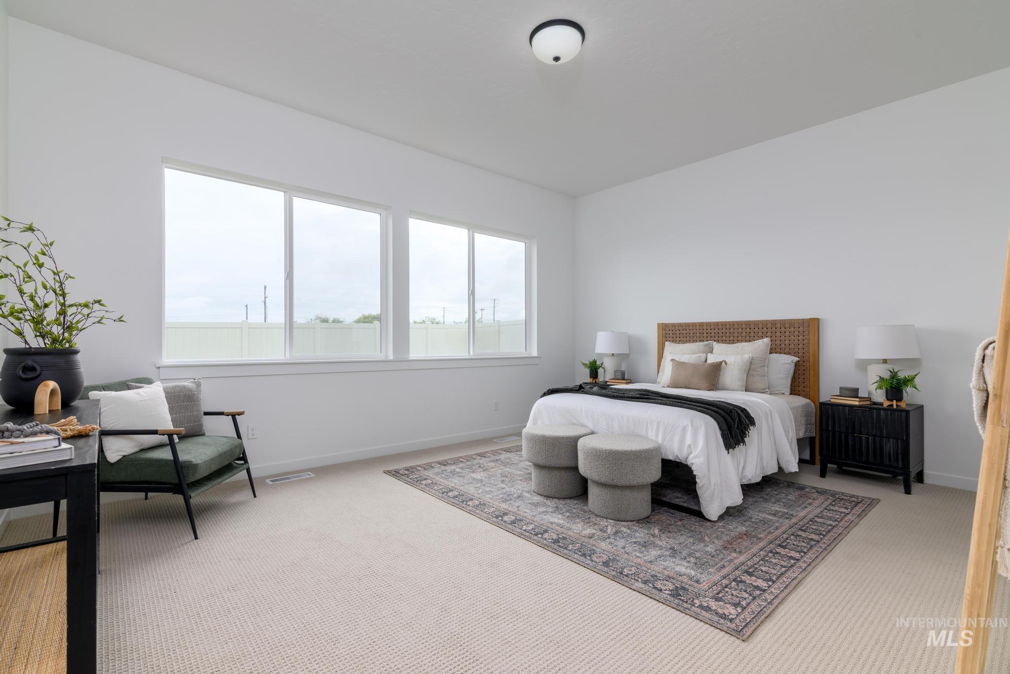 Carpeted bedroom featuring baseboards