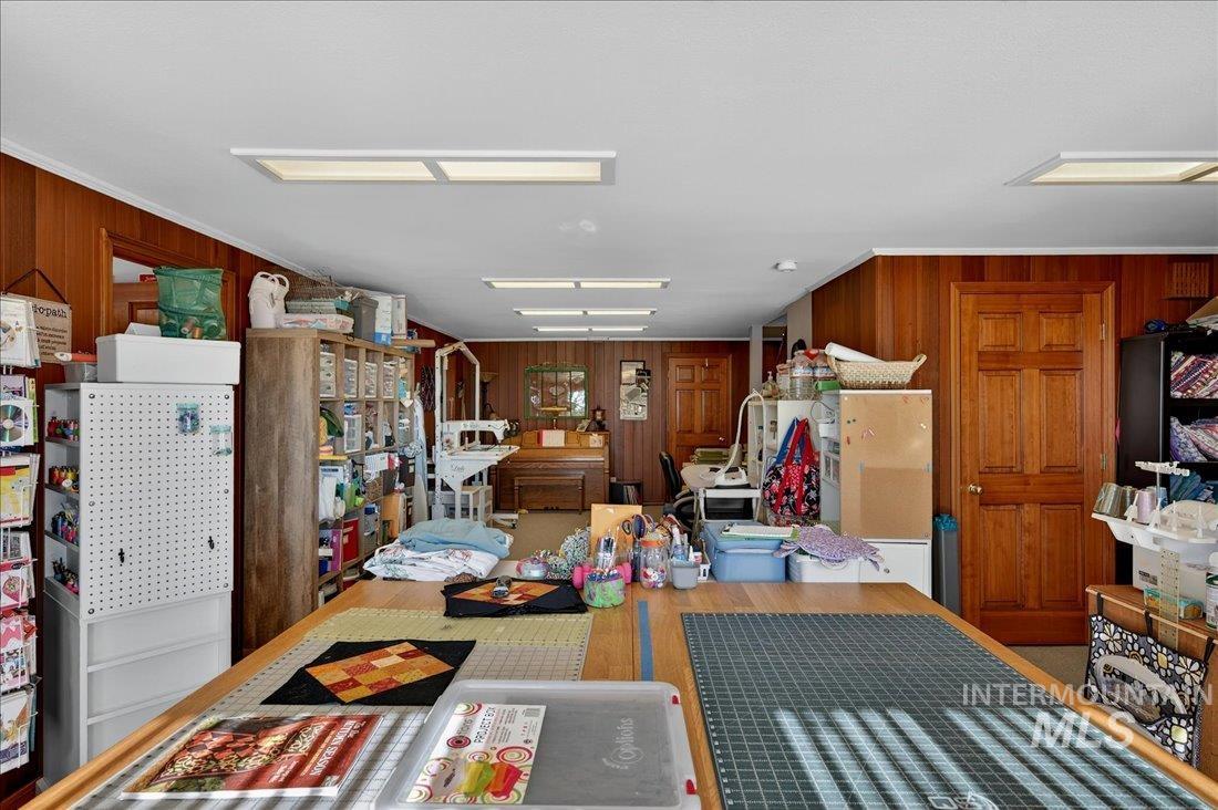 Kitchen with wood walls and ornamental molding