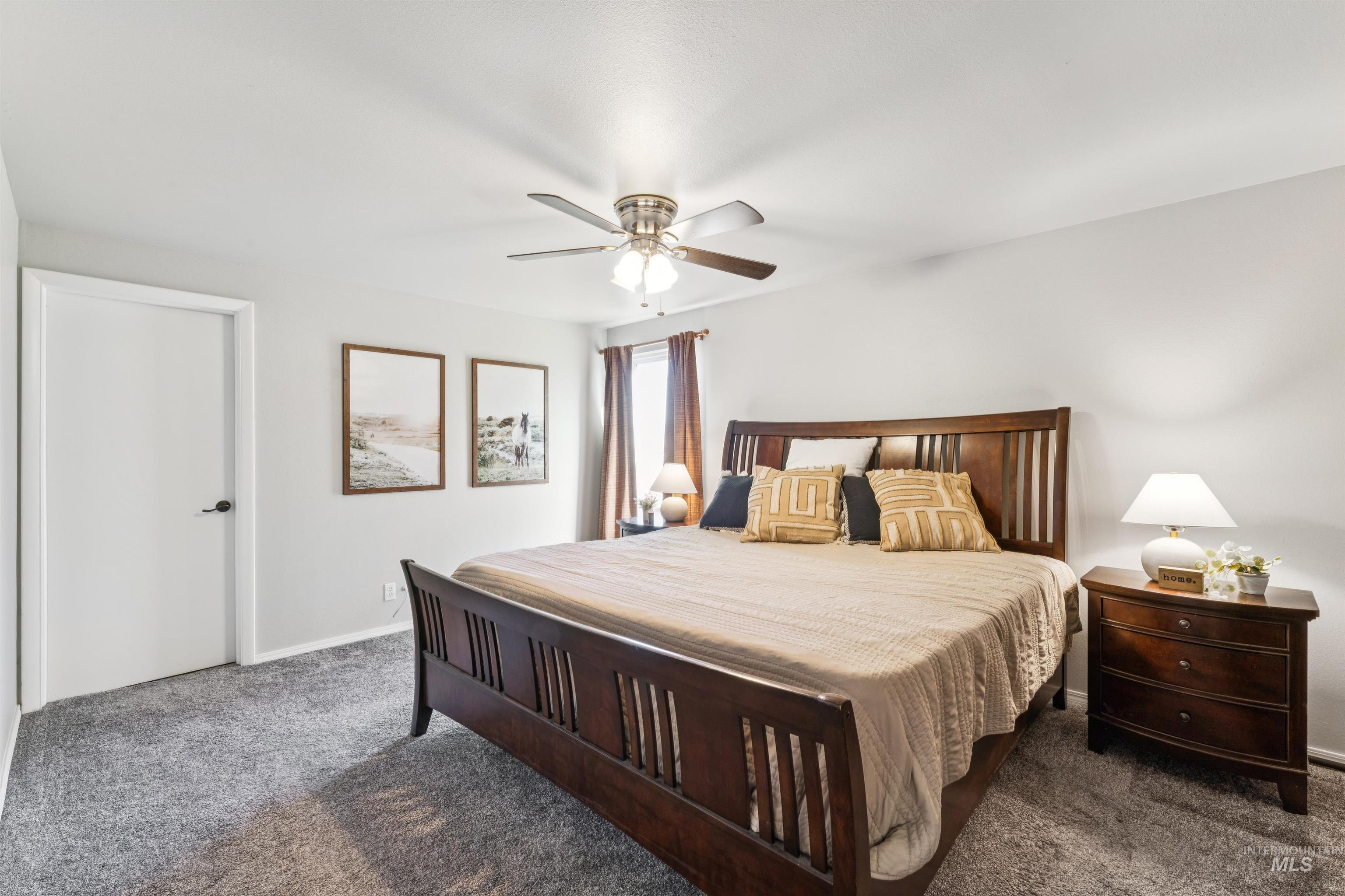 Bedroom with carpet and a ceiling fan