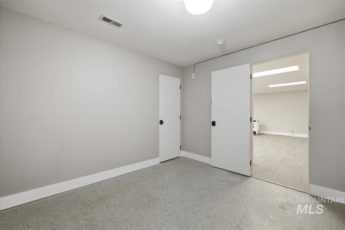 Unfurnished bedroom featuring baseboards