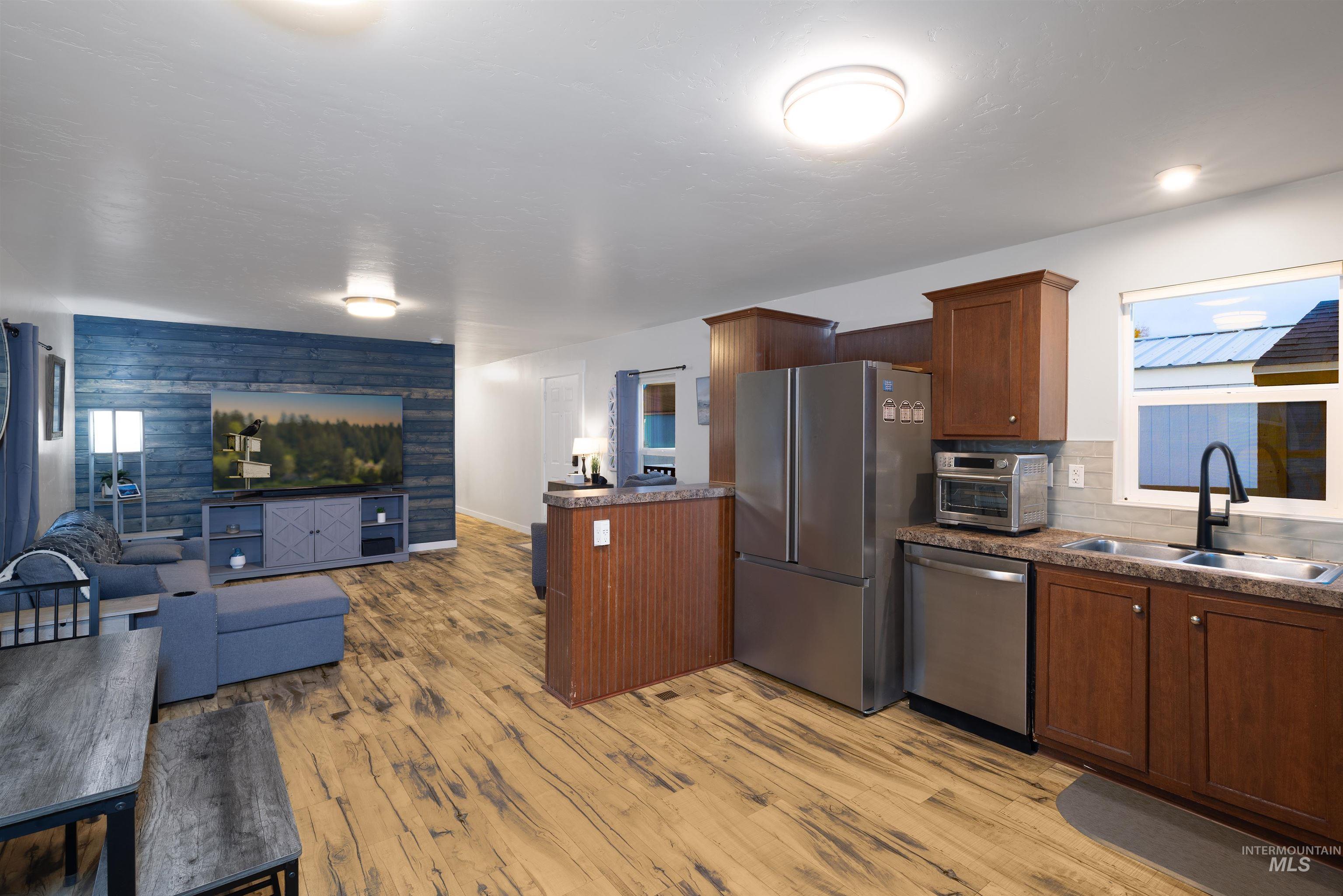 View of kitchen and living area from the back door