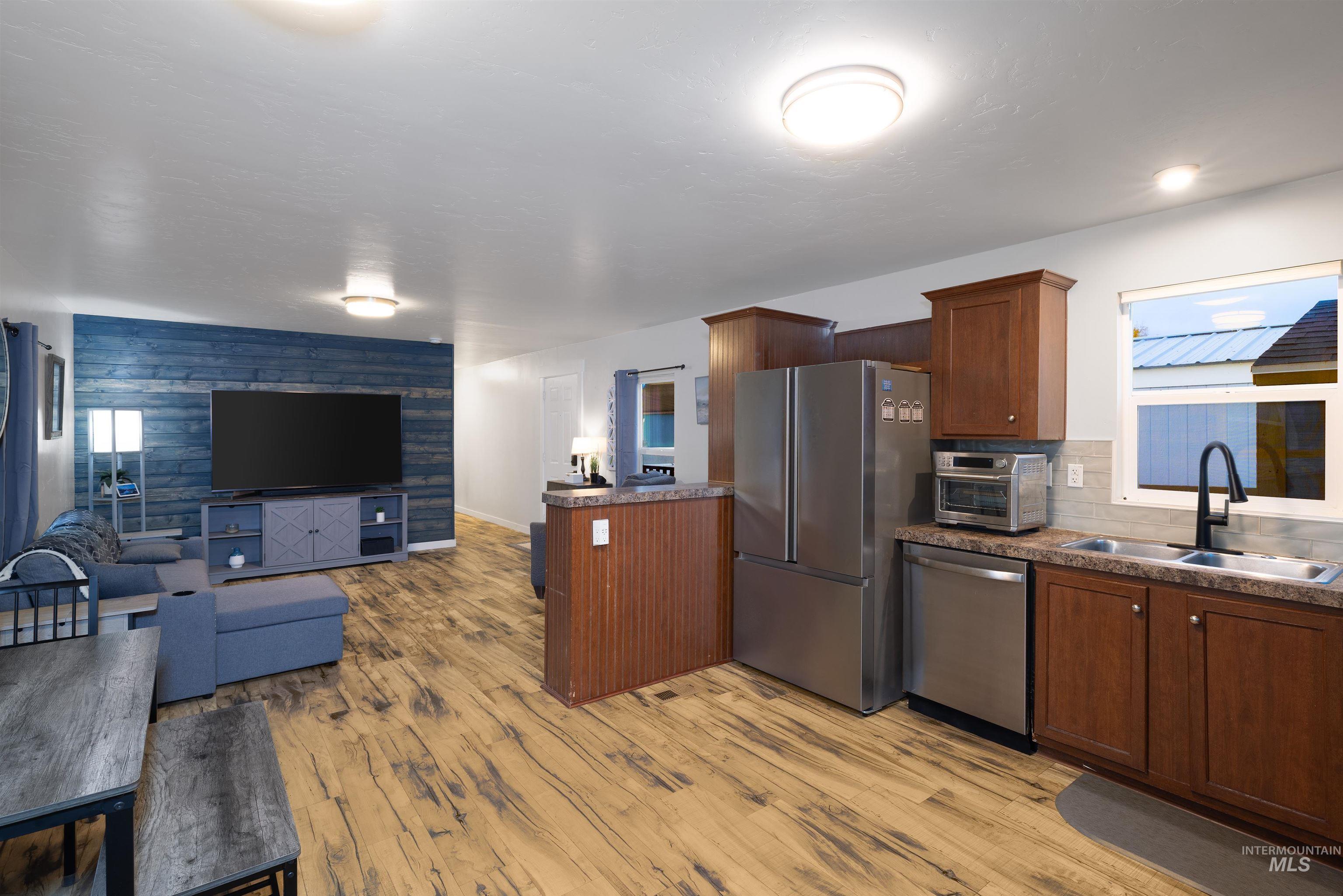 View of kitchen and living area from the back door