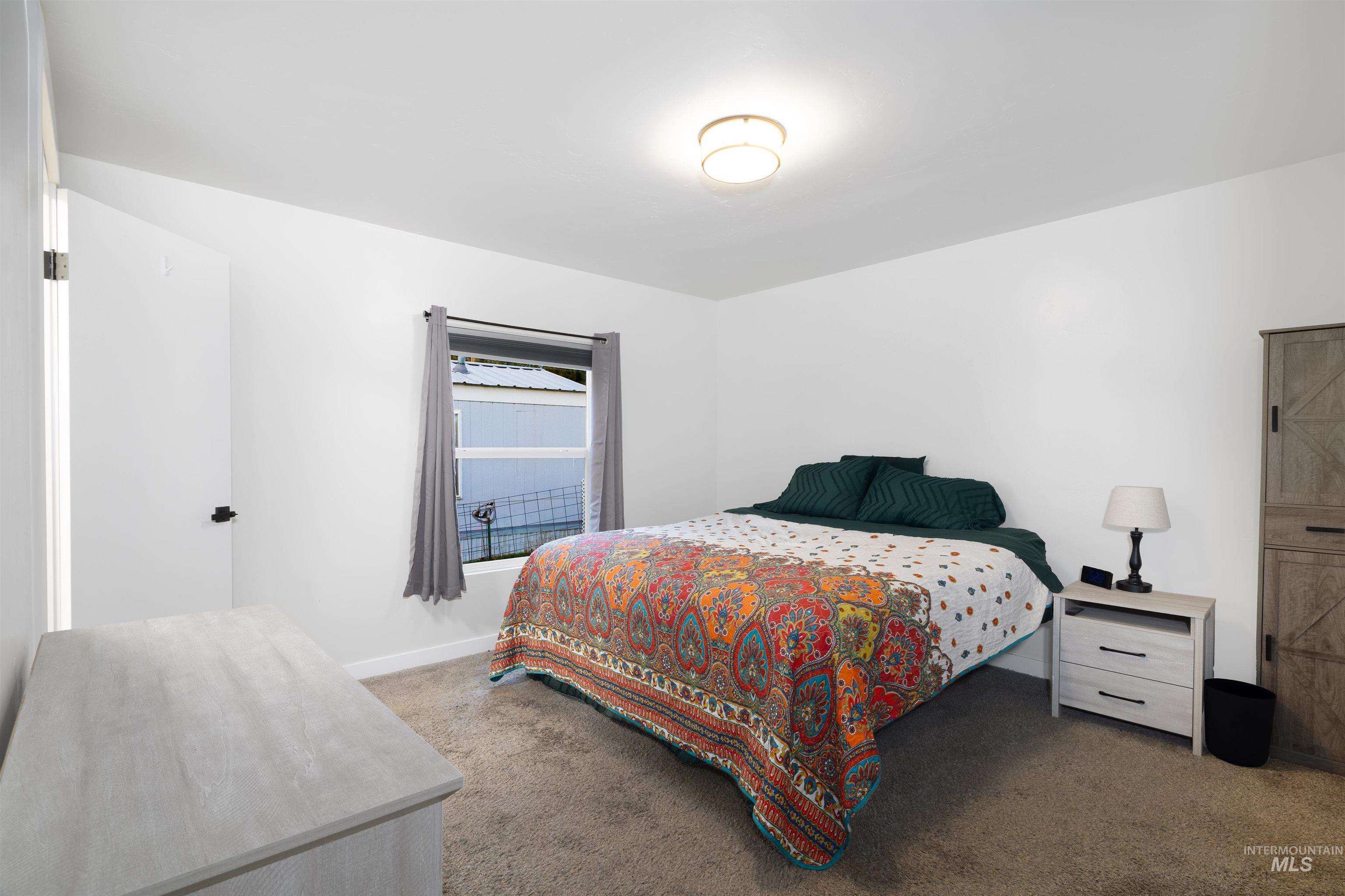 Generous sized east side primary bedroom with en-suite and north facing window.