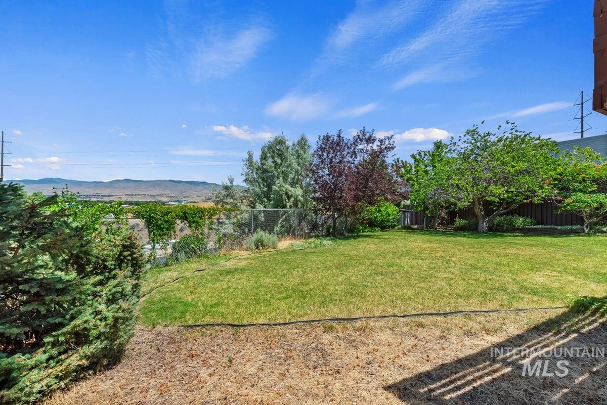 View of yard with a mountain view