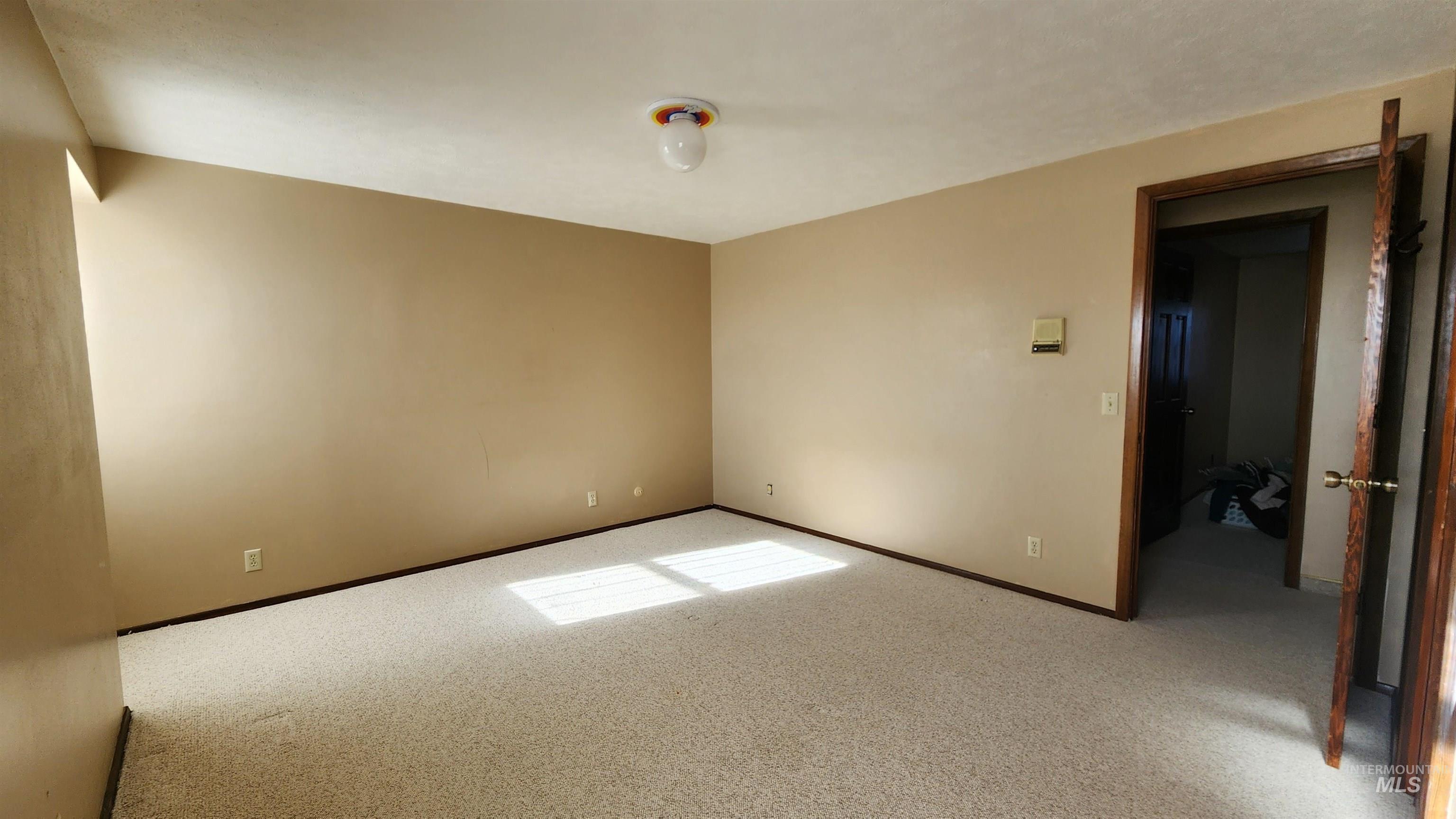 Bedroom #3 with large closet with built in storage shelves.