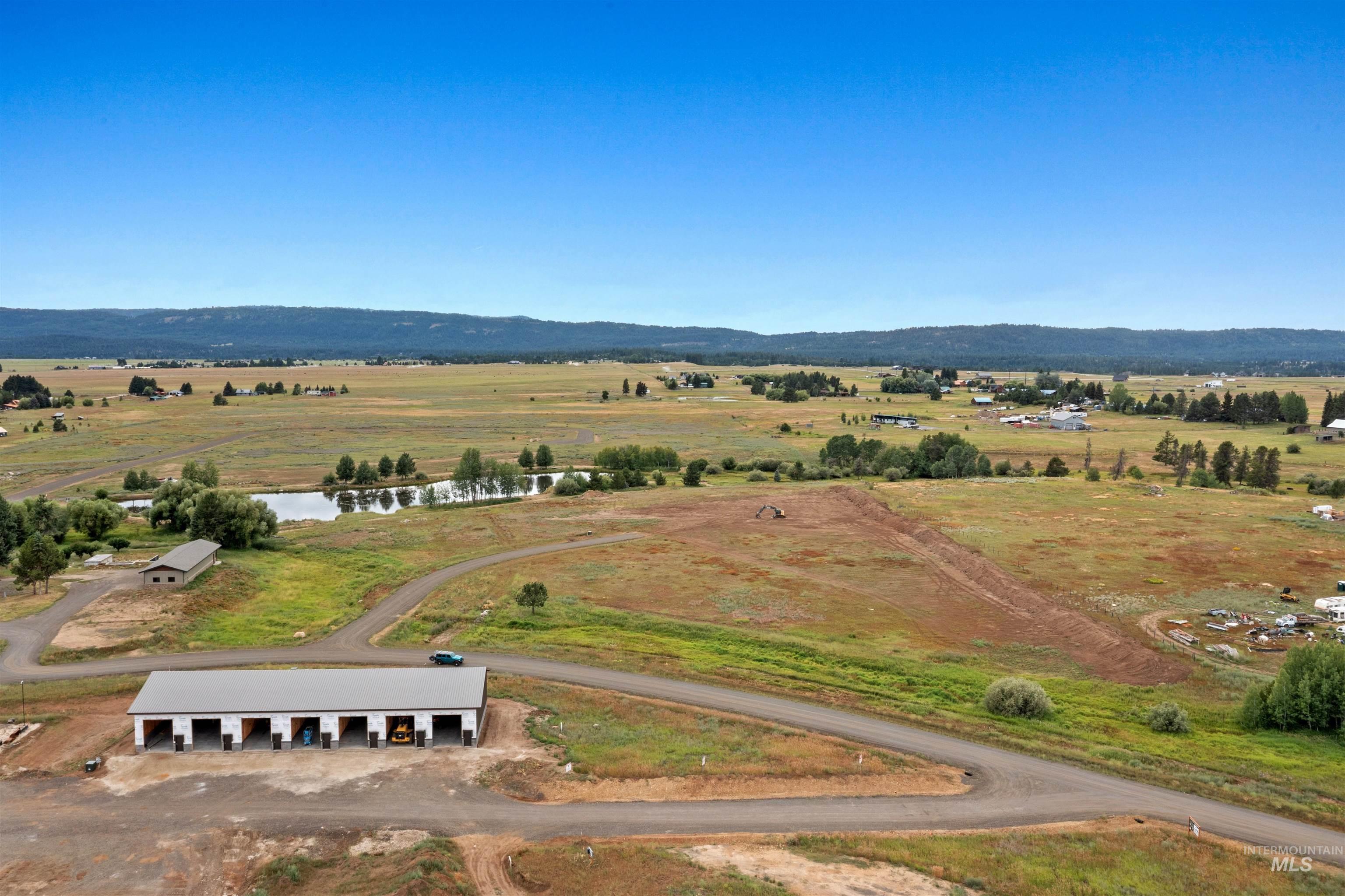 Aerial view of sparsely populated area with a mountainous background