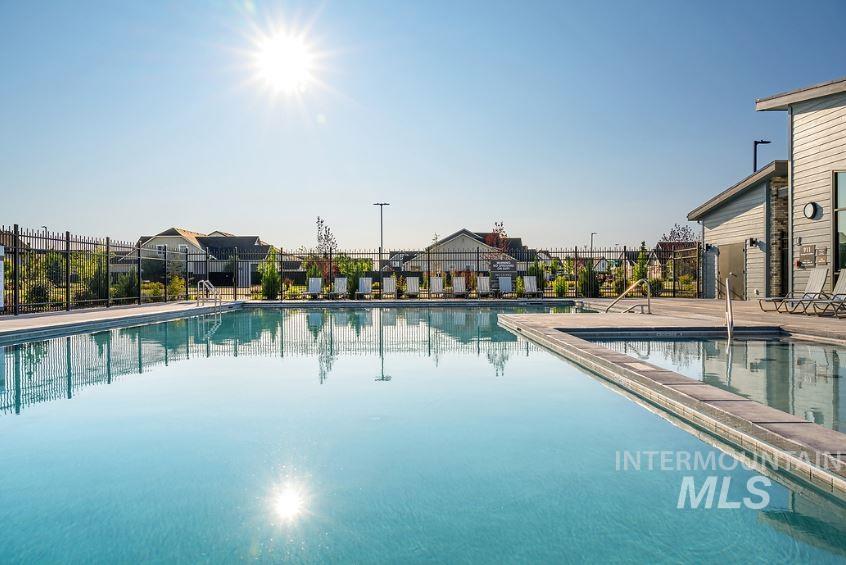 Community pool with a patio