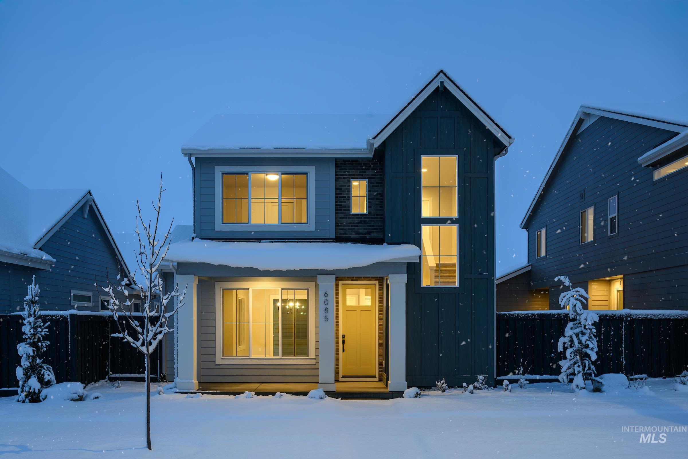 View of front of house featuring board and batten siding and covered porch
