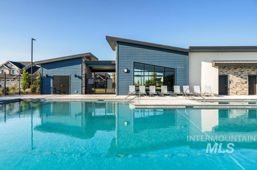 Community pool with a patio