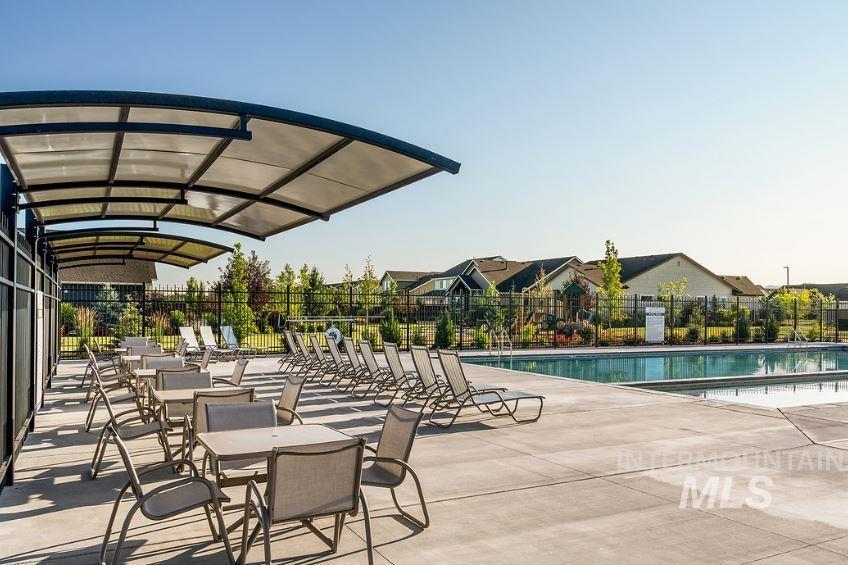 Community pool with a patio