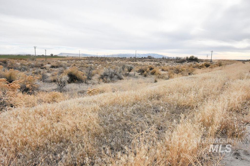 View of undeveloped land featuring rural landscape and a mountain backdrop