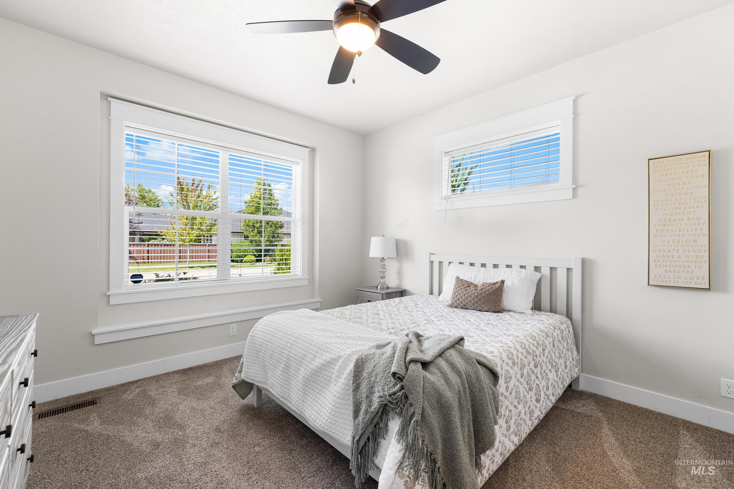 Bedroom with carpet floors and ceiling fan